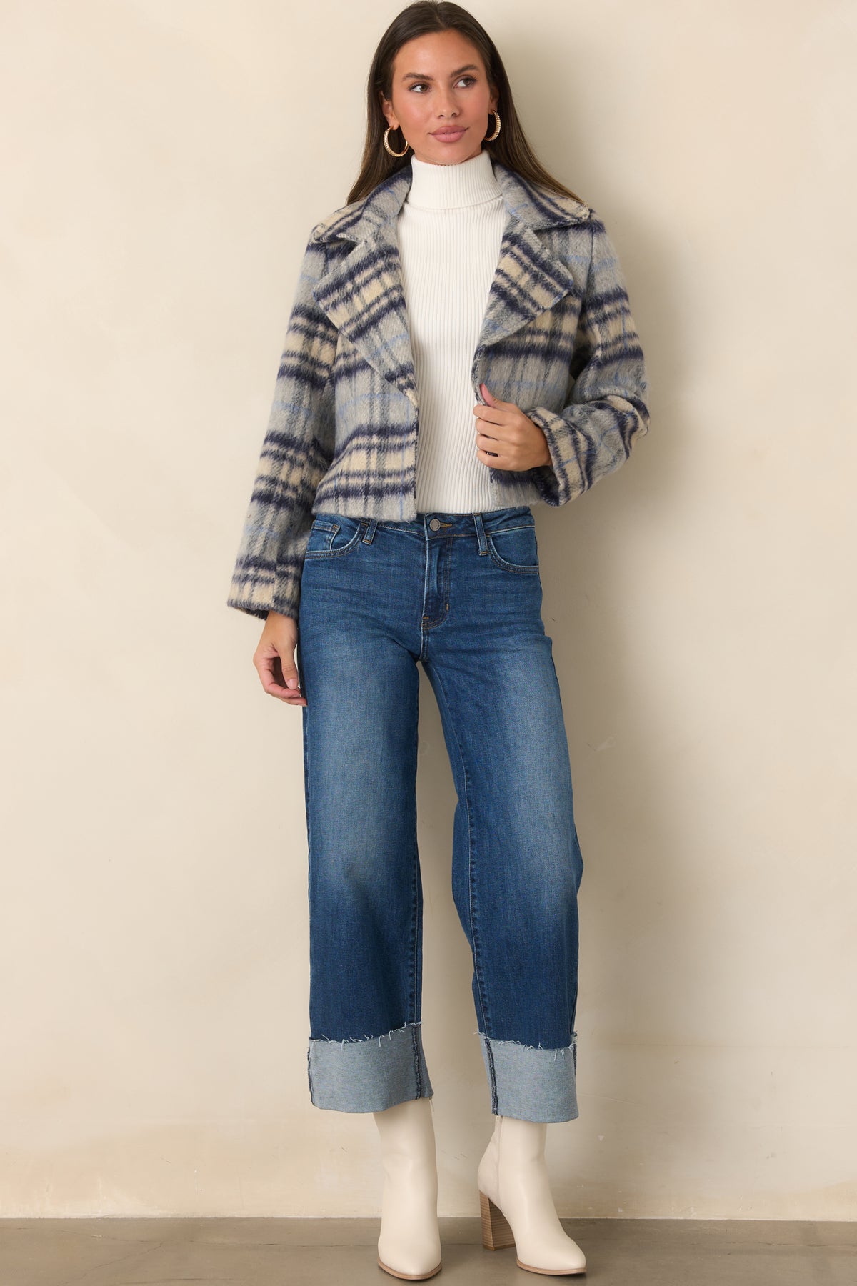 Dark wash wide-leg jeans with subtle fading and oversized turned cuffs.