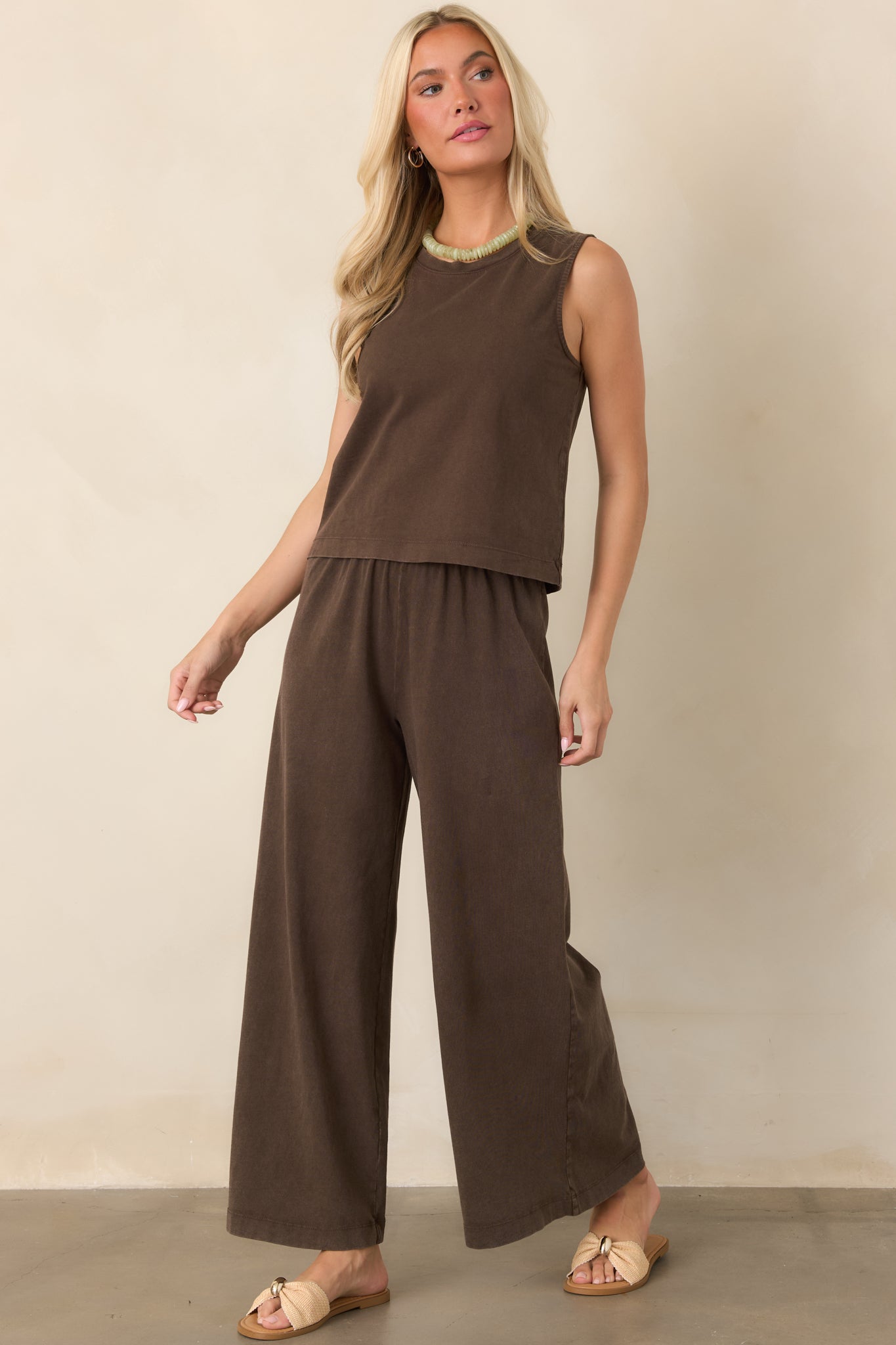 Lightweight deep brown muscle tank featuring a rounded crew neckline, sleeveless cut, and easy relaxed silhouette.