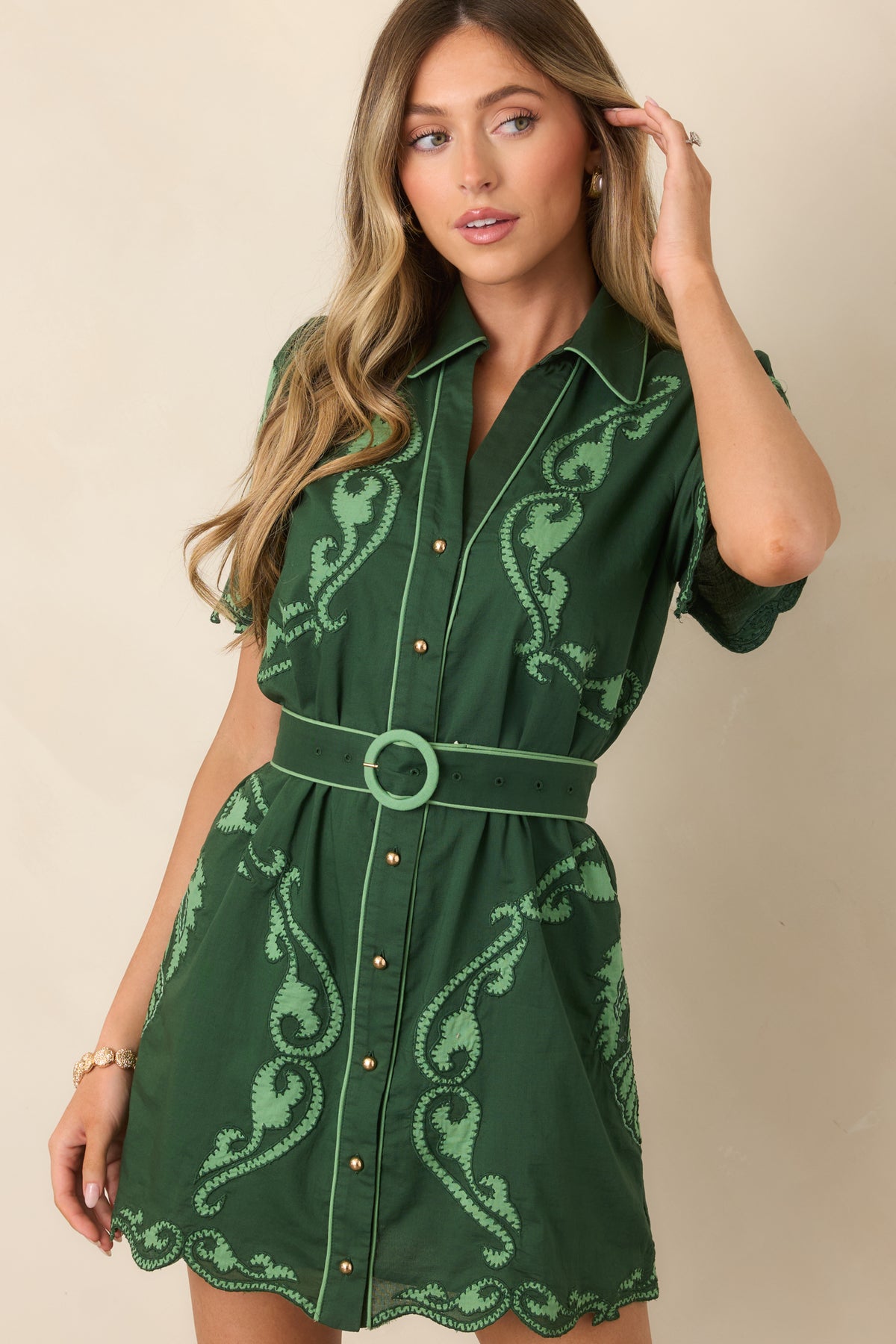 Scrollwork-patterned mini dress featuring a button-front closure and softly structured defined waist.