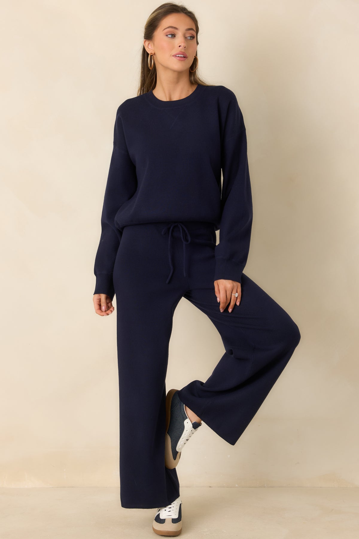 Deep navy pull-on pants with a high-rise waist and an easy wide-leg silhouette.