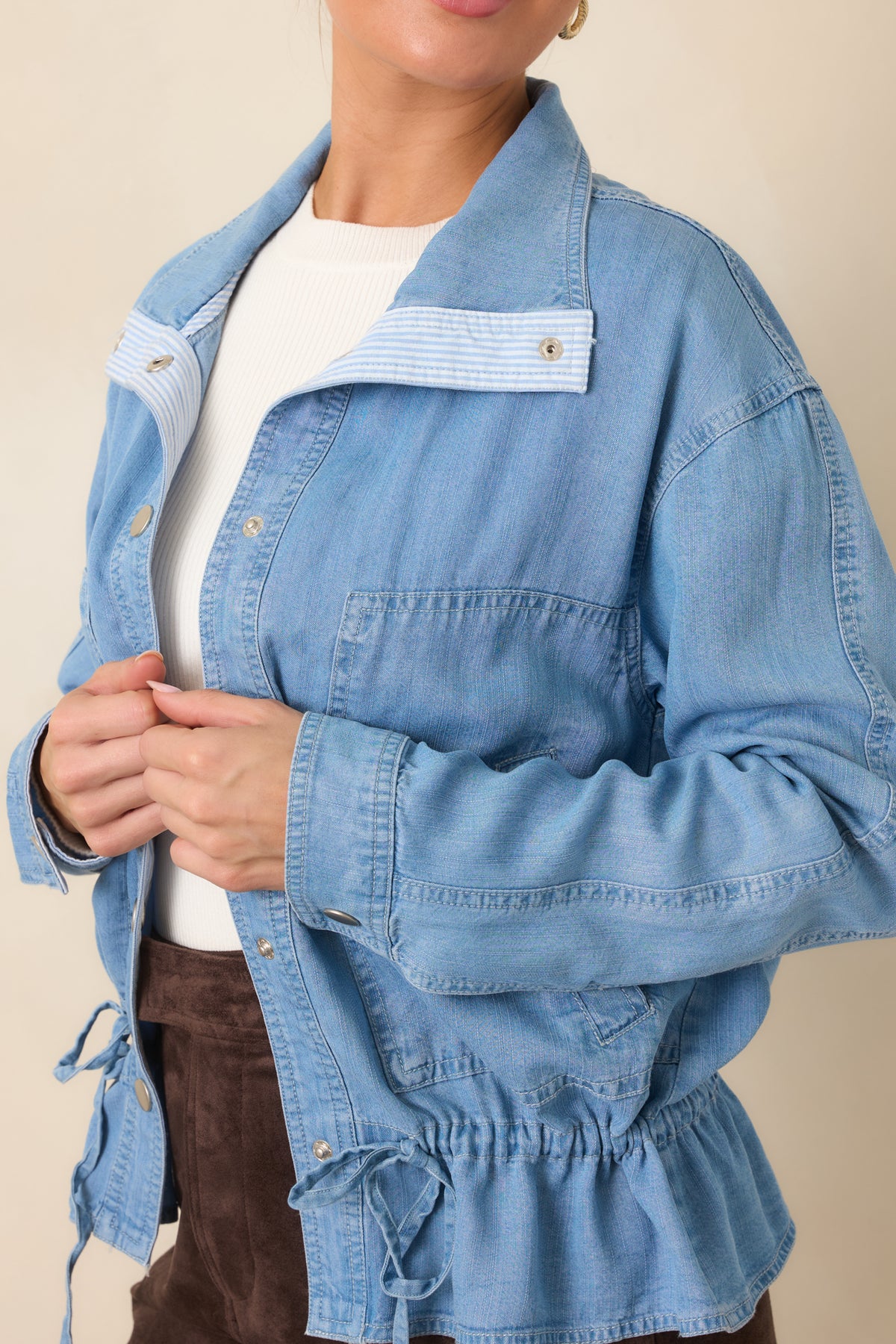 Close view highlighting the adjustable drawstring waist and softly gathered denim shaping.