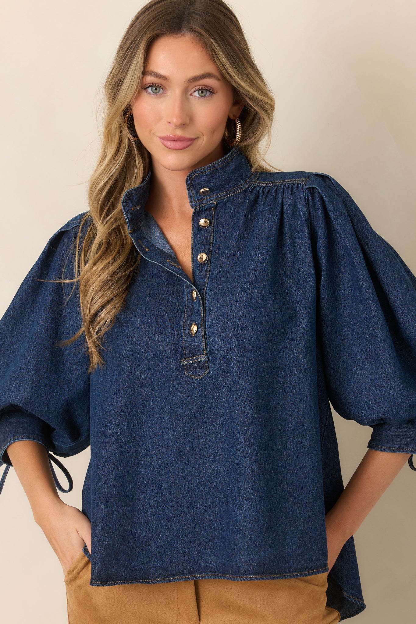 High-low hem creates graceful movement on this denim top, finished with practical side slits for an easy drape.