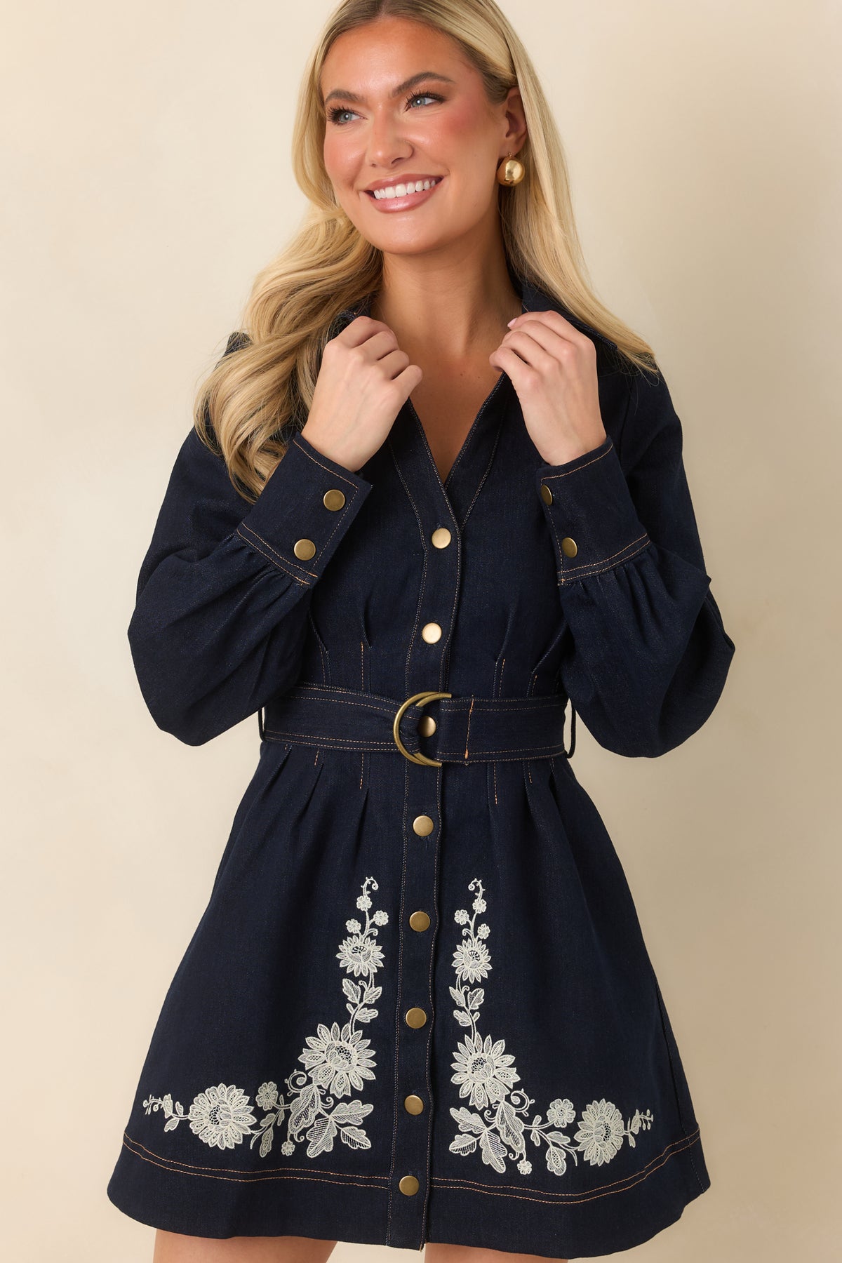  Indigo denim dress featuring warm contrast stitching along the tailored seams and pleated skirt.