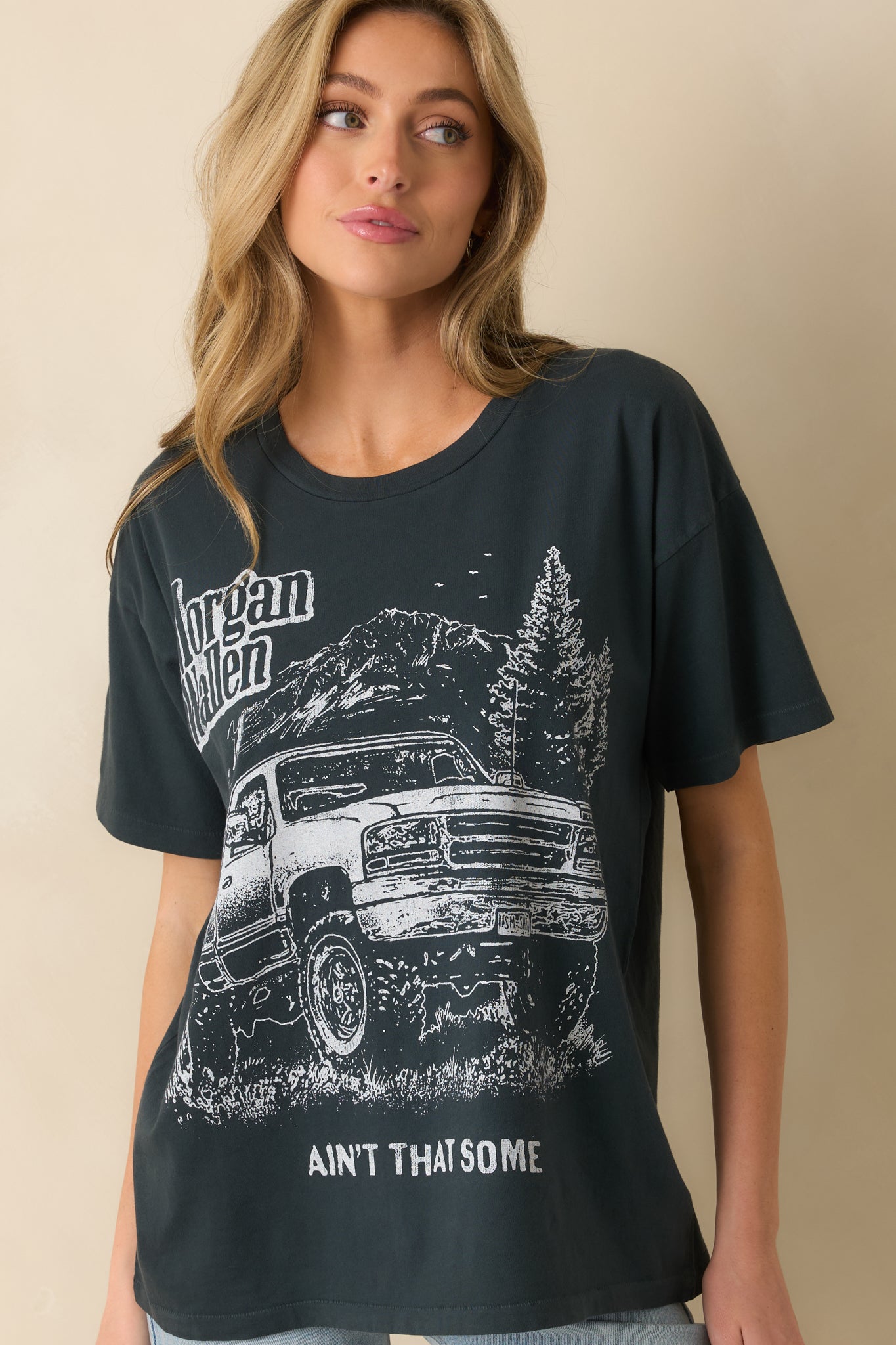 Detail of short sleeves and straight hem on vintage graphic tee.