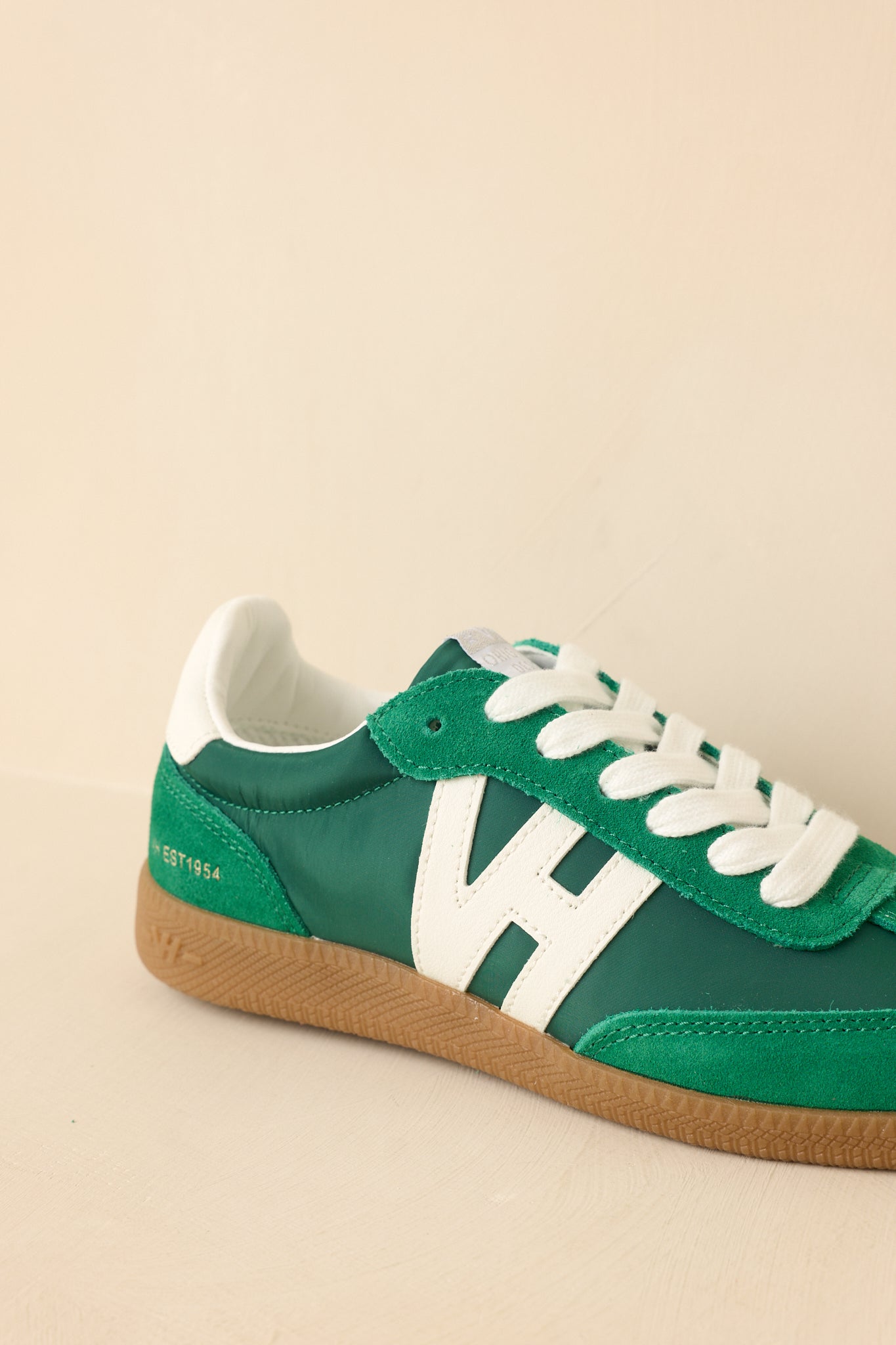 Cropped-in detail of the upper showing suede texture alongside smooth synthetic panels for a dimensional finish.