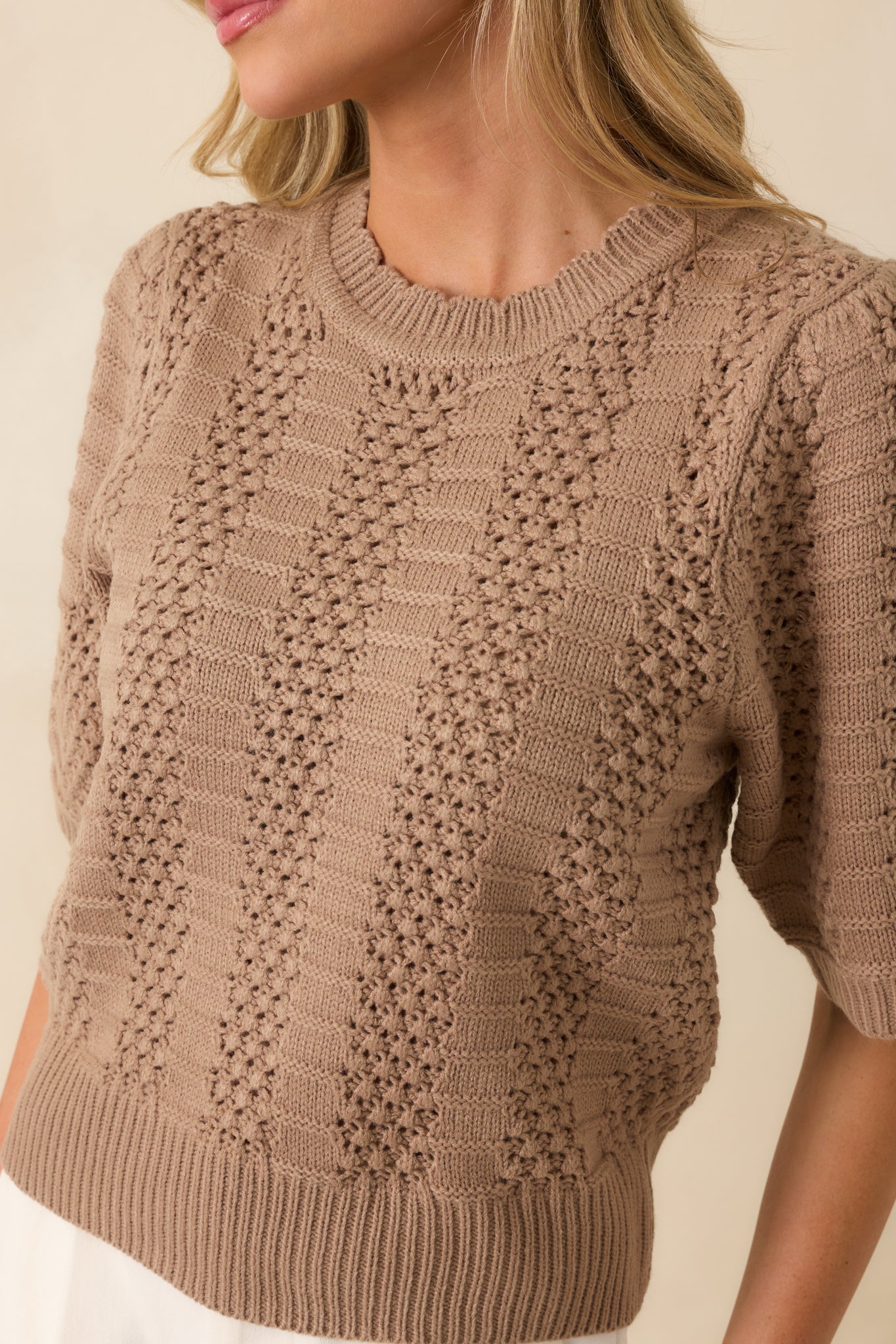 Detailed view of the alternating crochet and ribbed panels, capturing the texture and stitch work.
