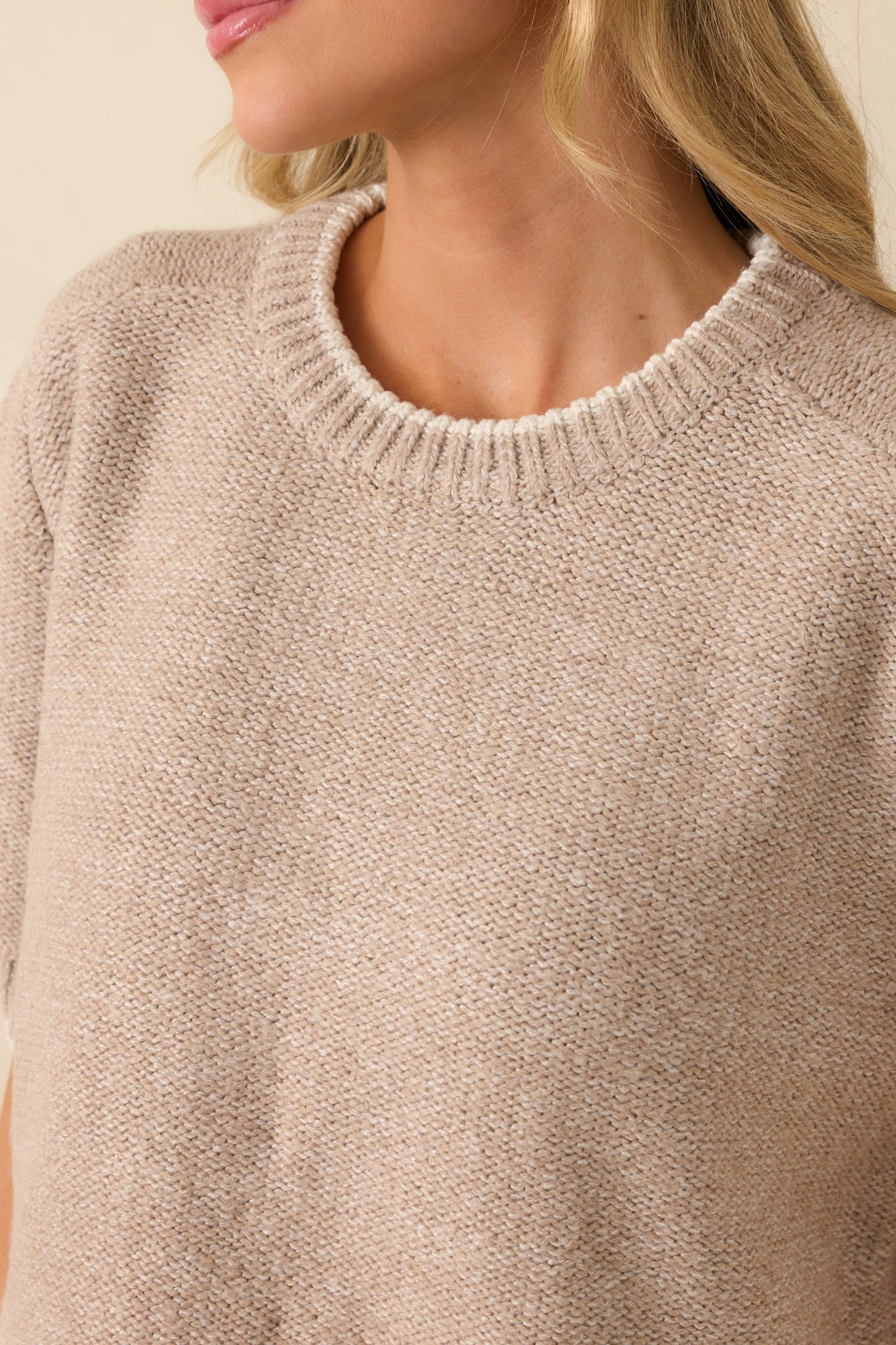 Detailed shot of the crew neckline, contrast trim, and knit fabric.