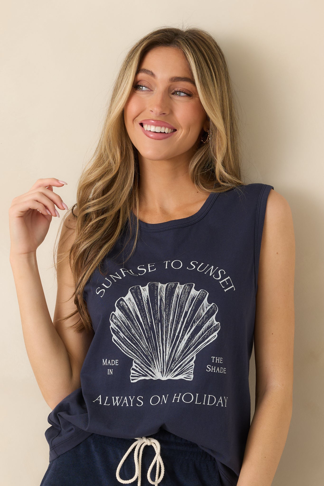 Detailed view of front graphic featuring shell design and “Sunrise to Sunset” lettering.
