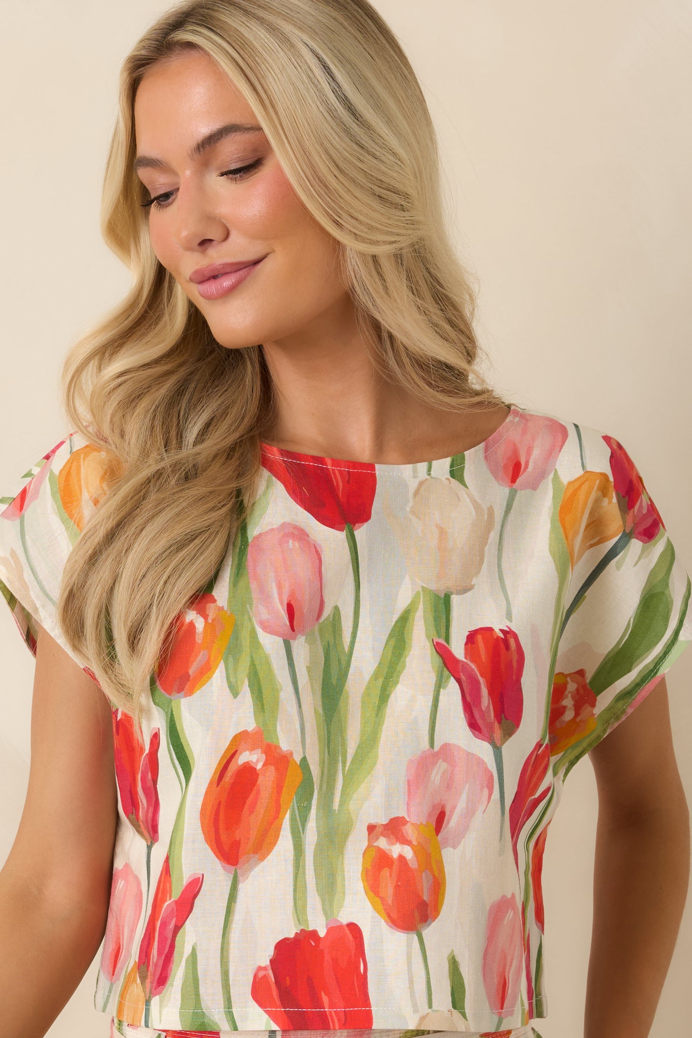 Detailed front view of the tulip print cropped top with a breezy silhouette and soft multi-colored floral pattern.