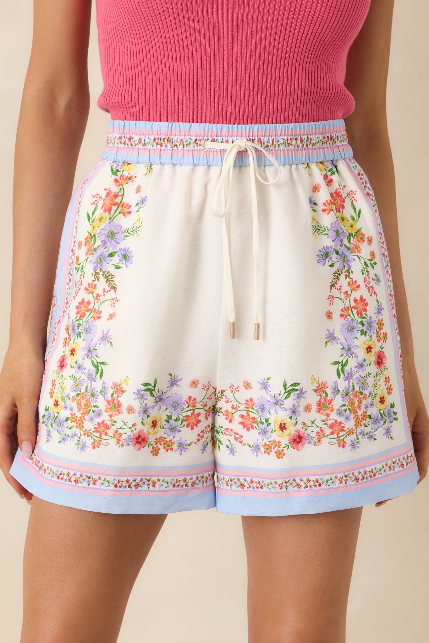 Detailed look at floral print and border trim on lightweight fabric.