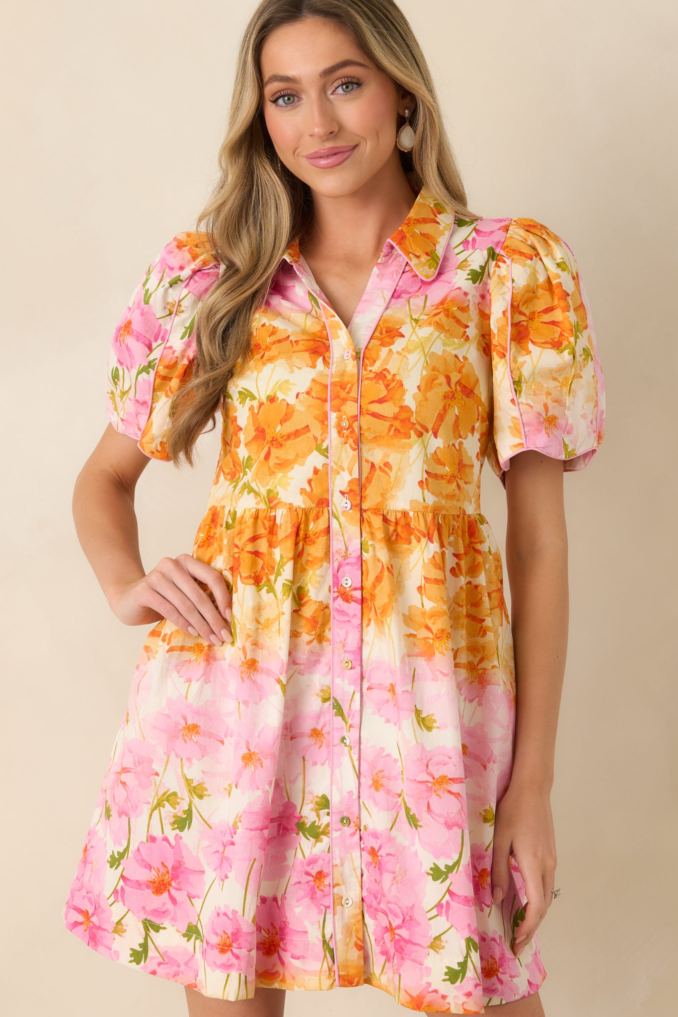Detailed look at puff sleeves with scalloped edges and subtle contrast piping.