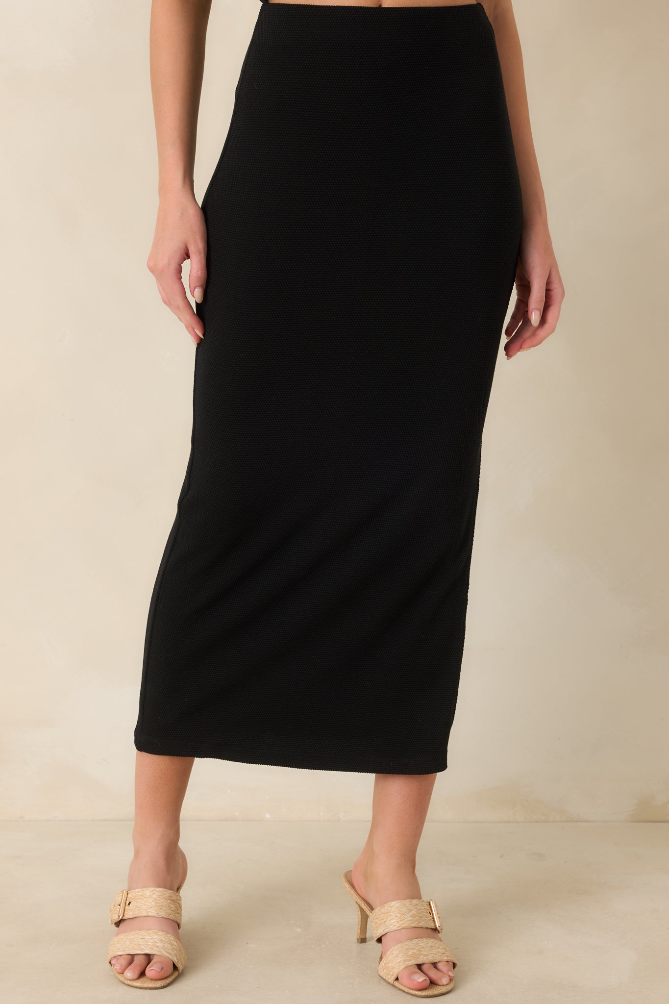 Detailed look at stretchy textured fabric with clean lines and flattering fit.