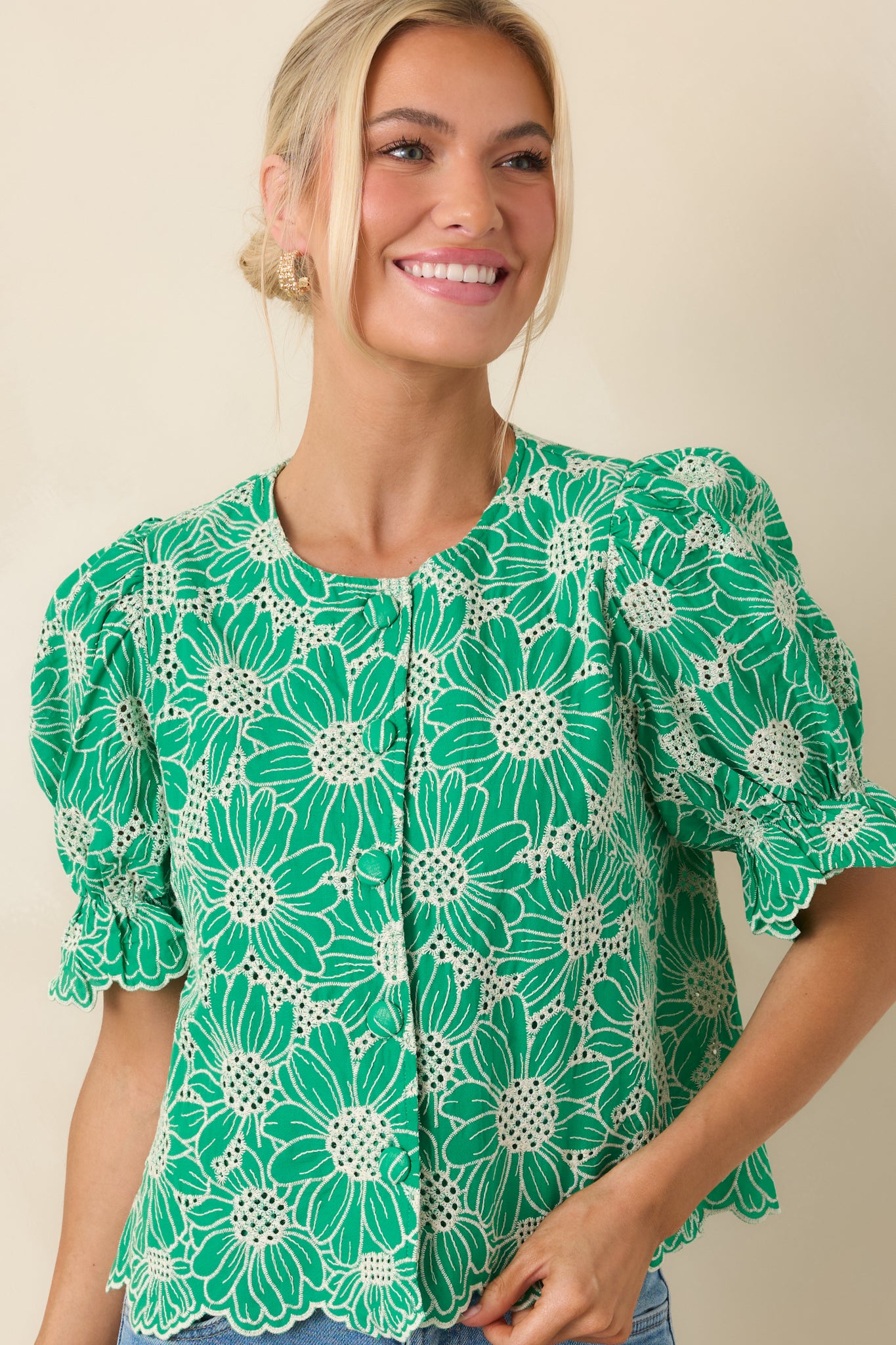 Detailed look at the embroidered pattern and delicate eyelet throughout the top.