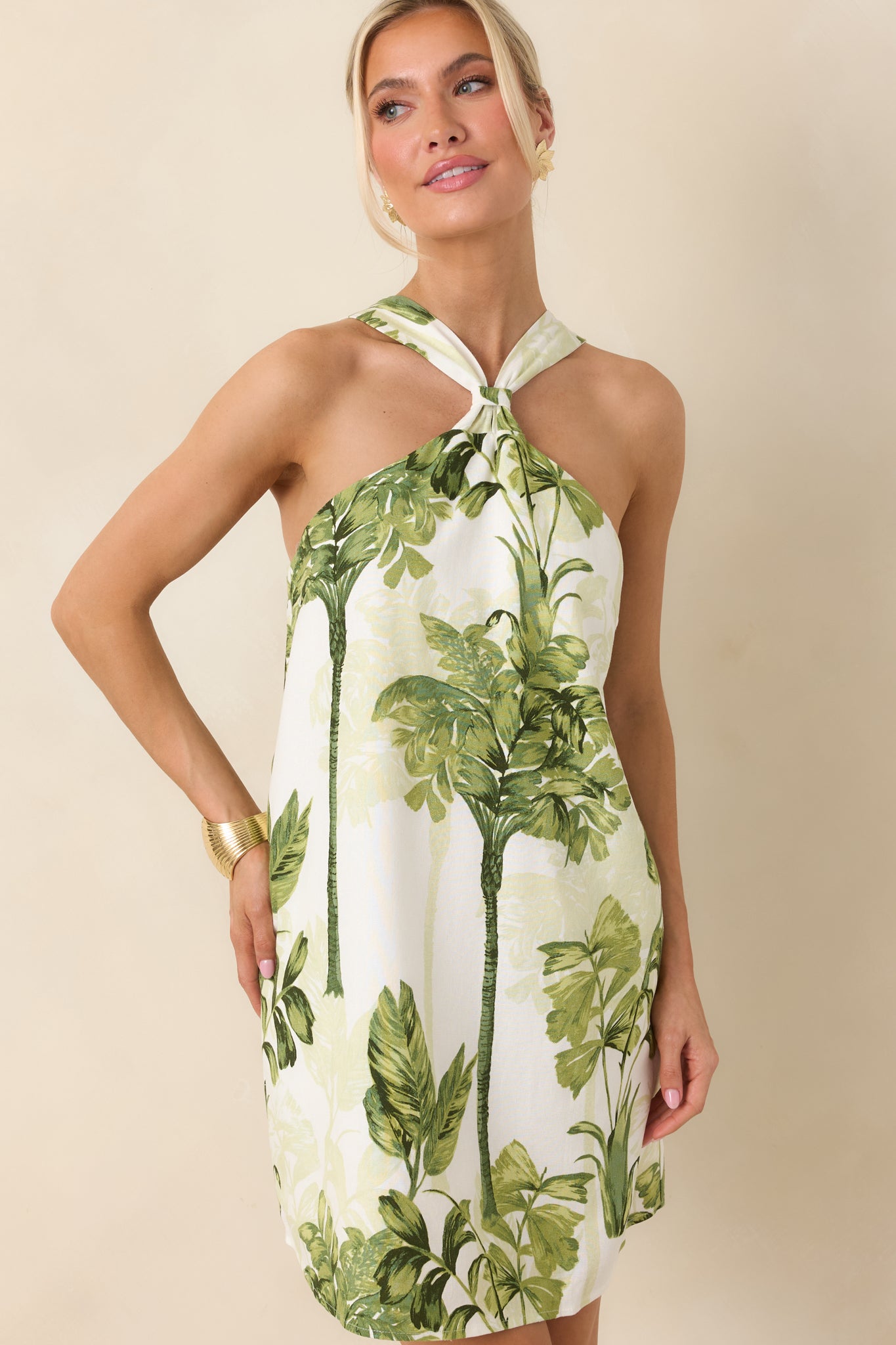 Detailed look at the lightweight woven fabric with vibrant palm print and clean seam finishes.