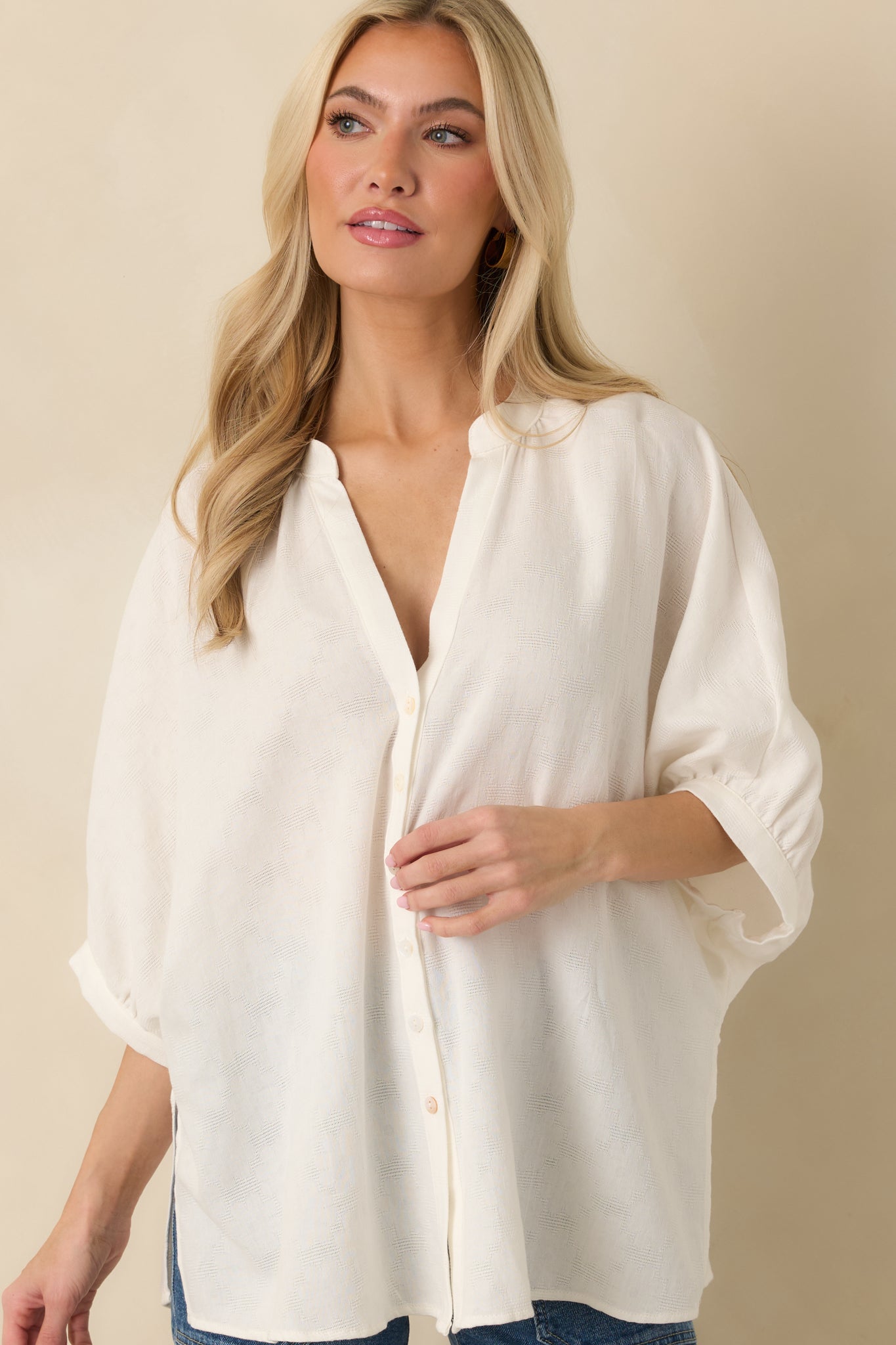 Detailed look at functional buttons and lightweight fabric texture.