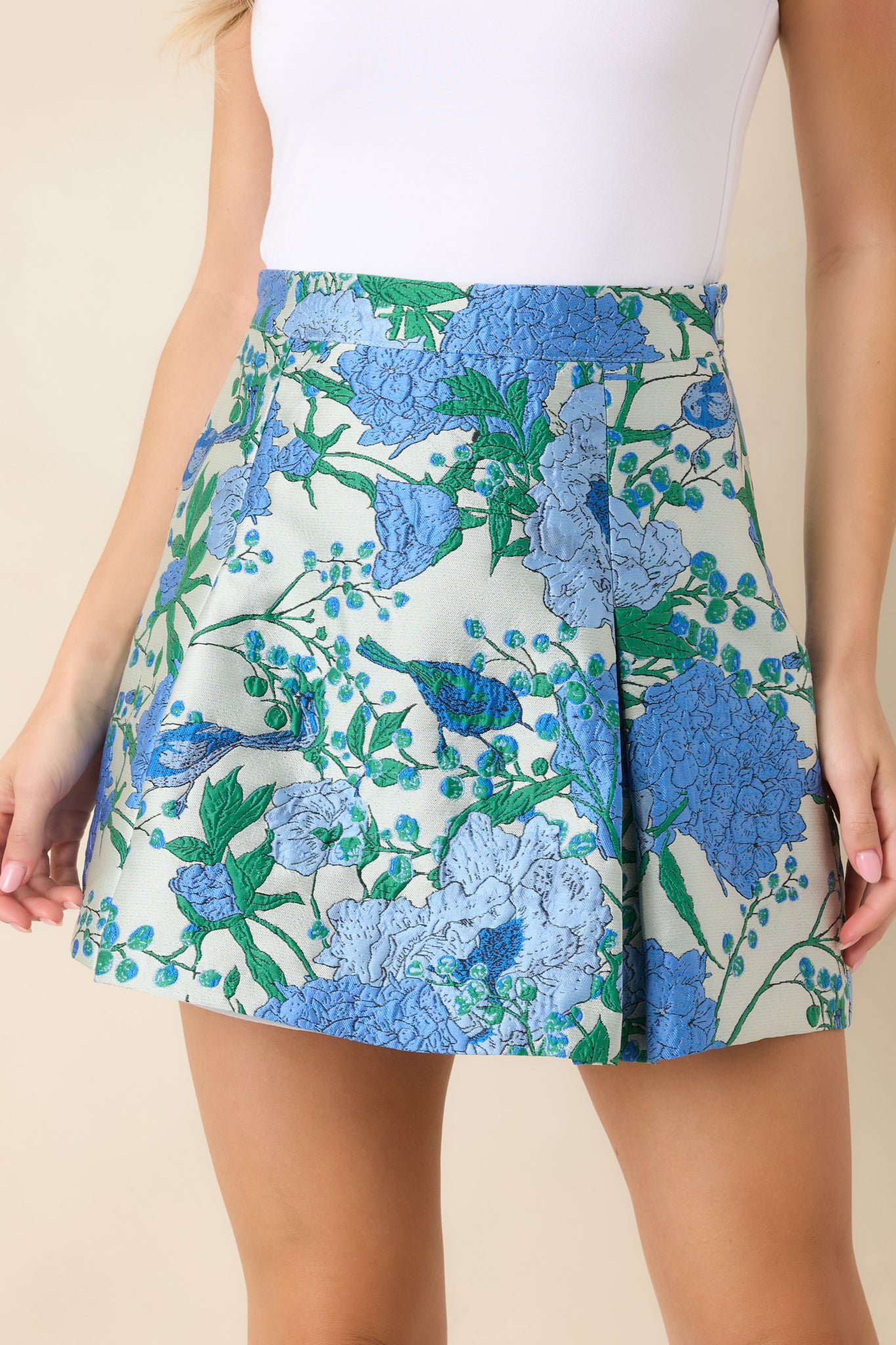 Detailed look at the jacquard fabrication showcasing the intricate blue floral design woven directly into the material.