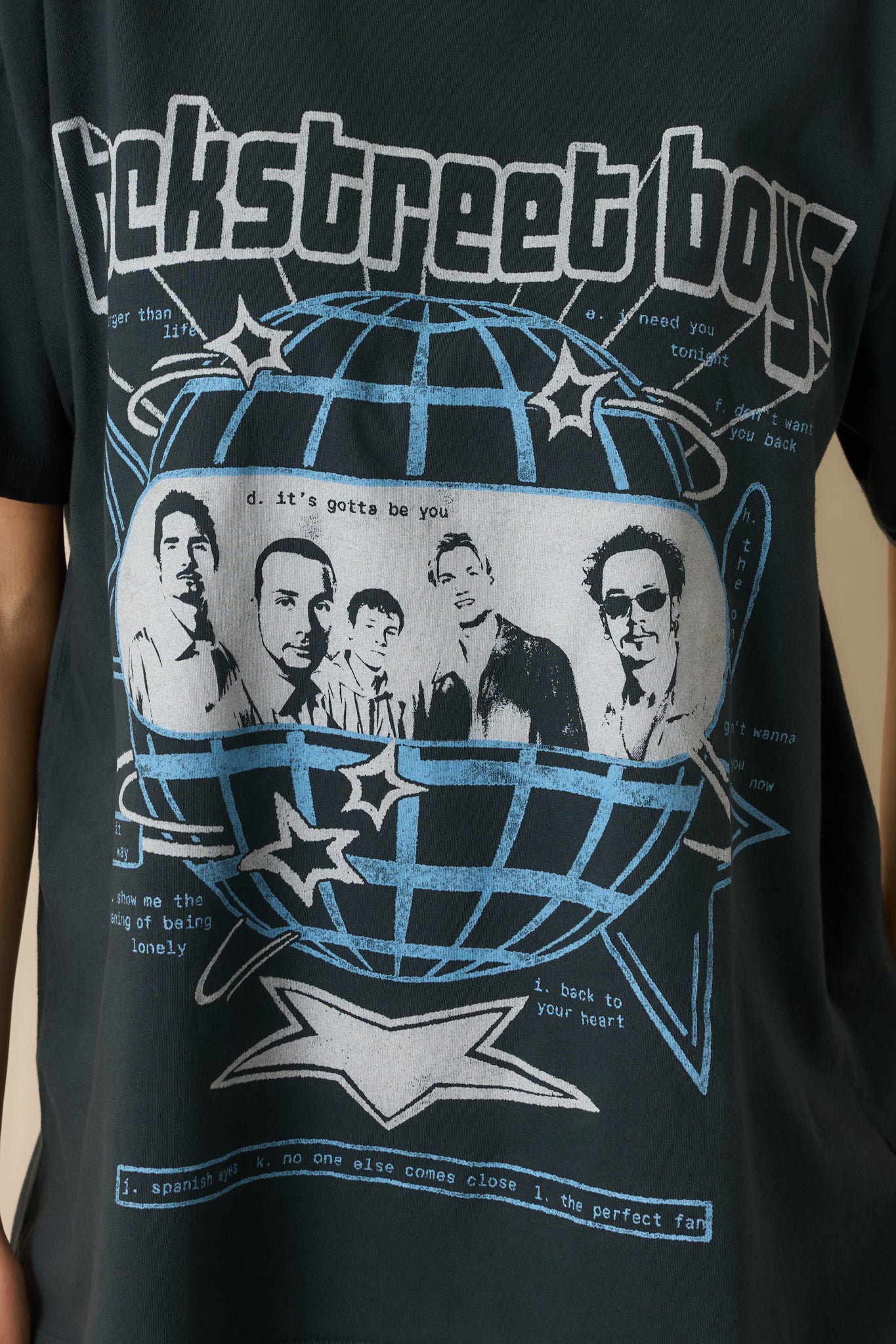 Detailed look at the printed Backstreet Boys tour graphic and cotton texture.
