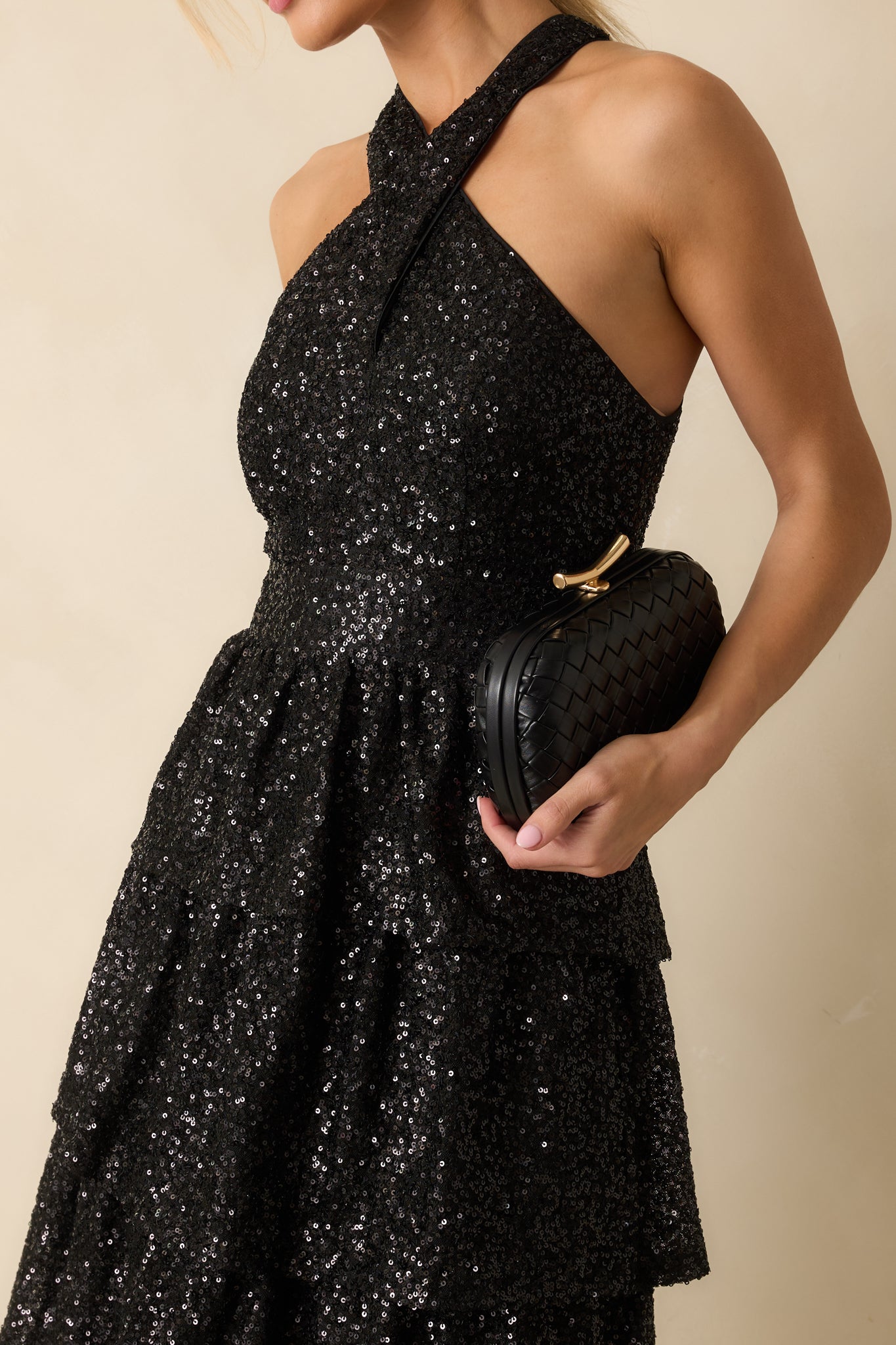 Detailed view of the black sequins and tiered layers highlighting the sparkle and fabric texture
