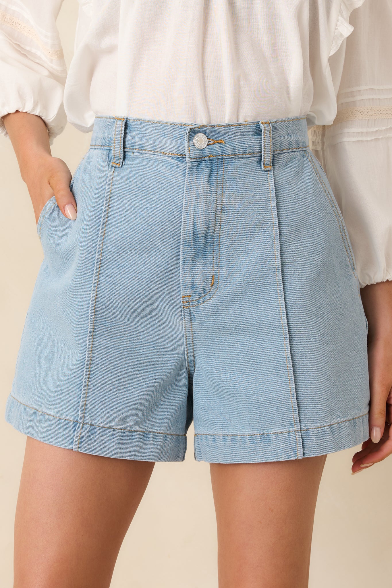 Detailed view of the soft denim fabric, featuring a lived-in wash and seam detailing.