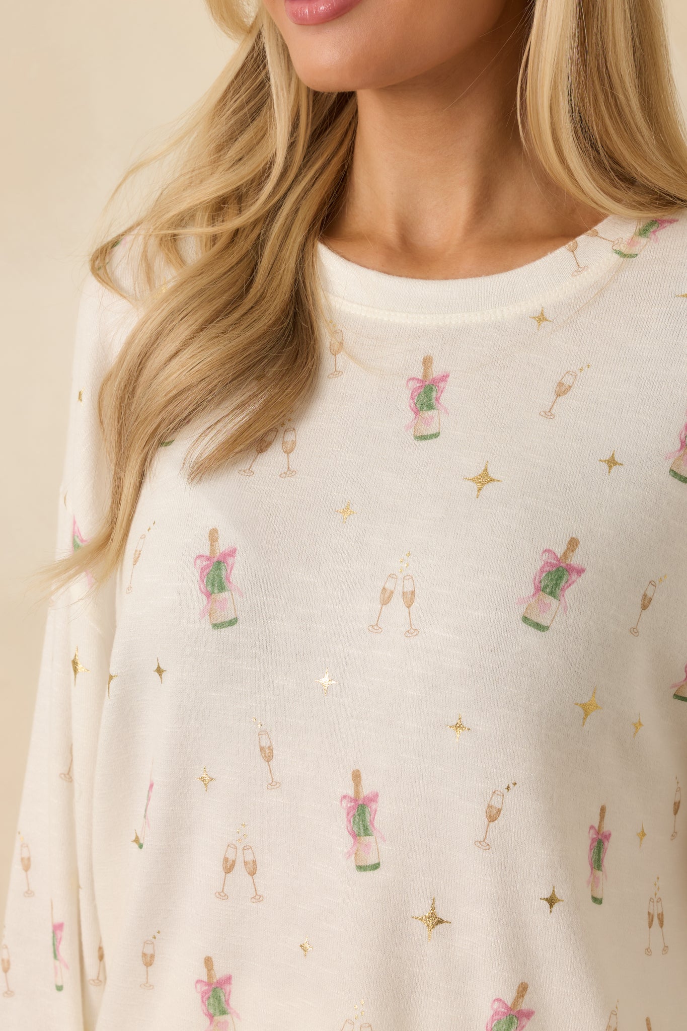 Detailed view of the print elements, brushed knit texture, and ribbed trim.