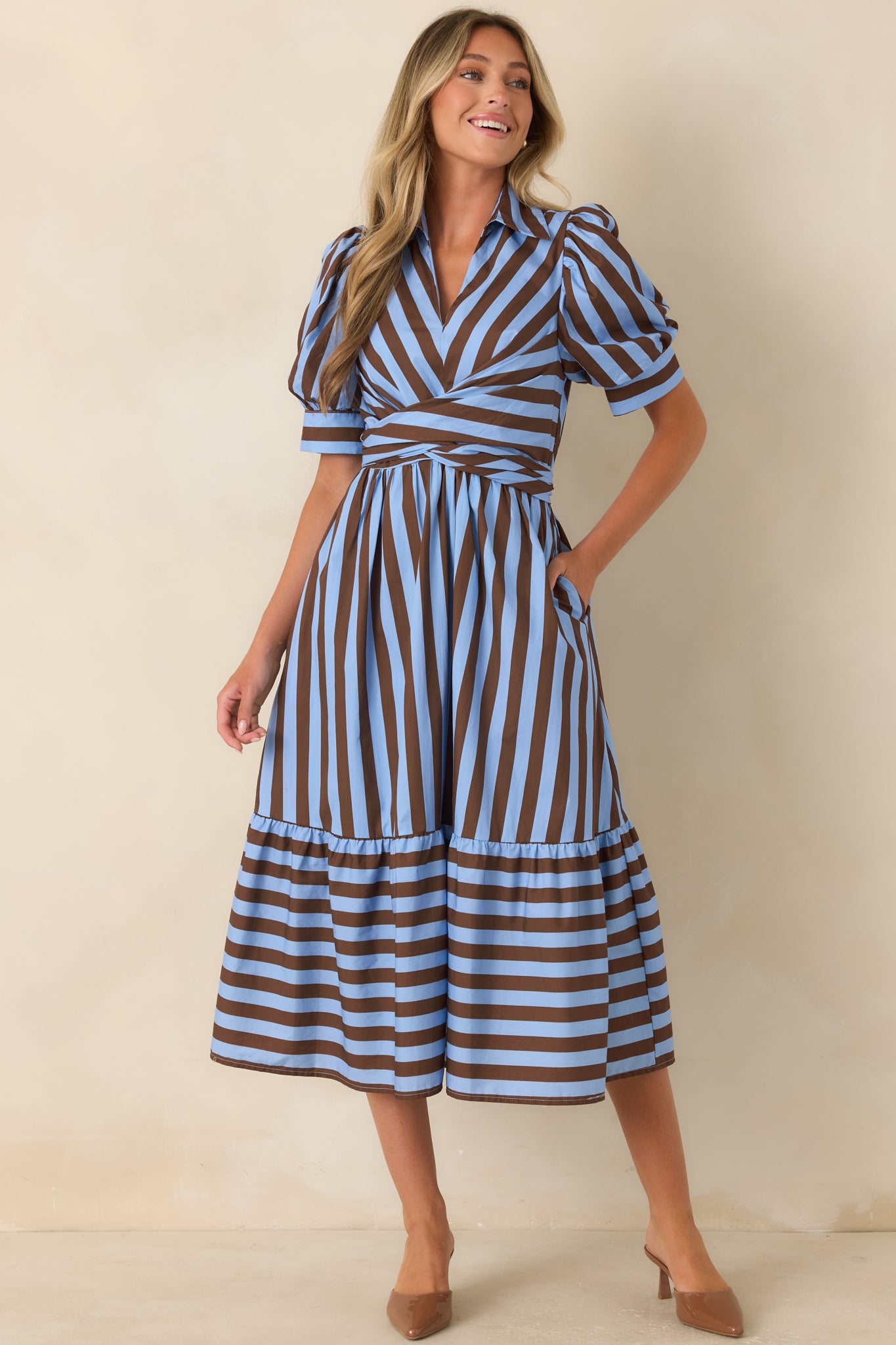 Midi dress crafted from breathable cotton with diagonal striped panels across the bodice, a structured collar, and softly gathered skirt.
