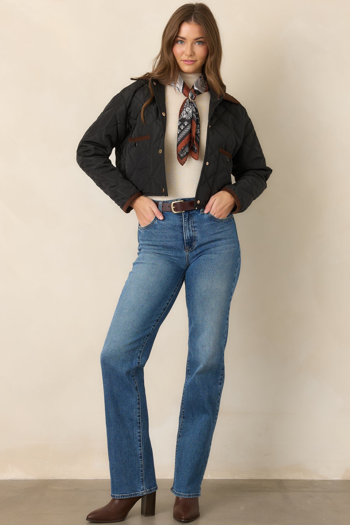 Polished diamond-stitched jacket featuring a contrasting brown collar, patch pockets, snap closure, and cropped hemline.