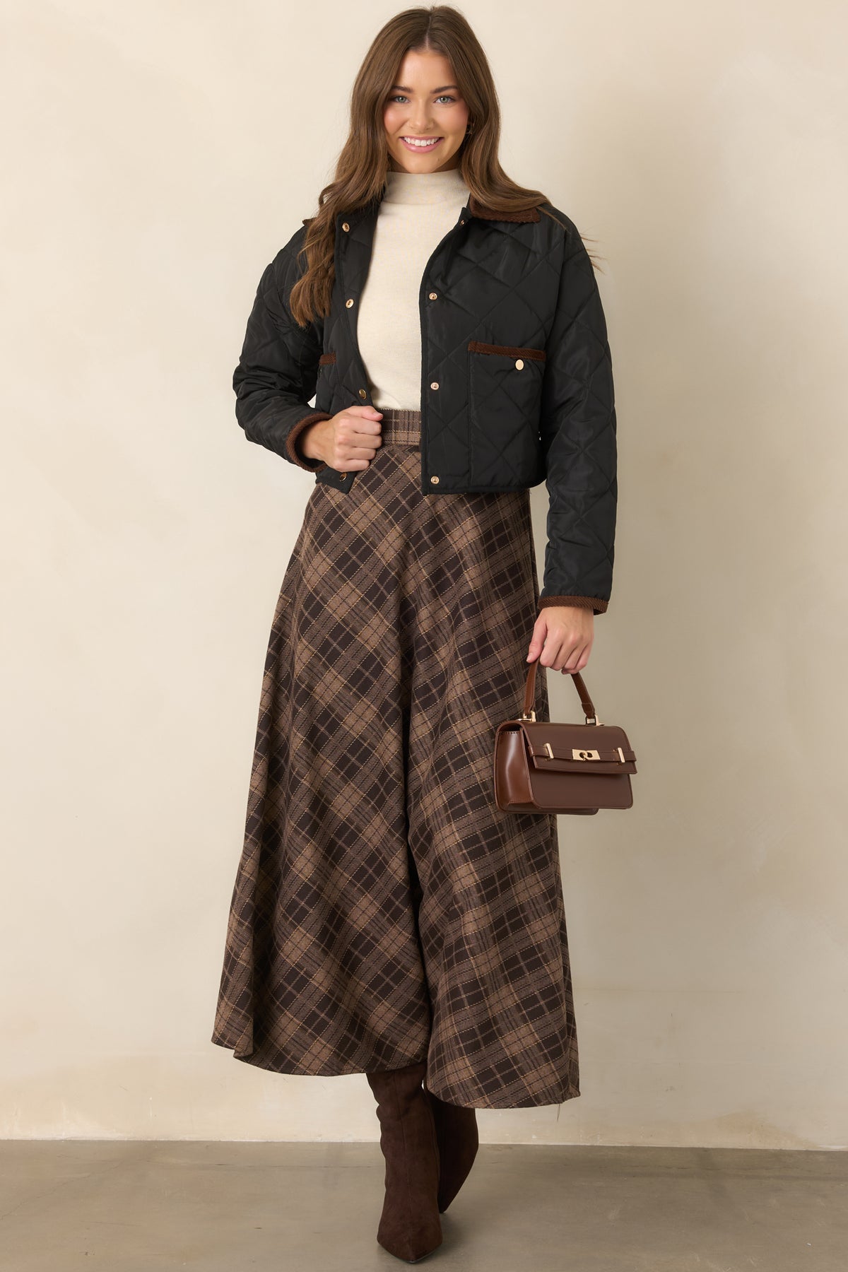Heritage-inspired jacket showcasing a classic diamond-stitched design, brown collar, contrast-trimmed patch pockets, and long sleeves.