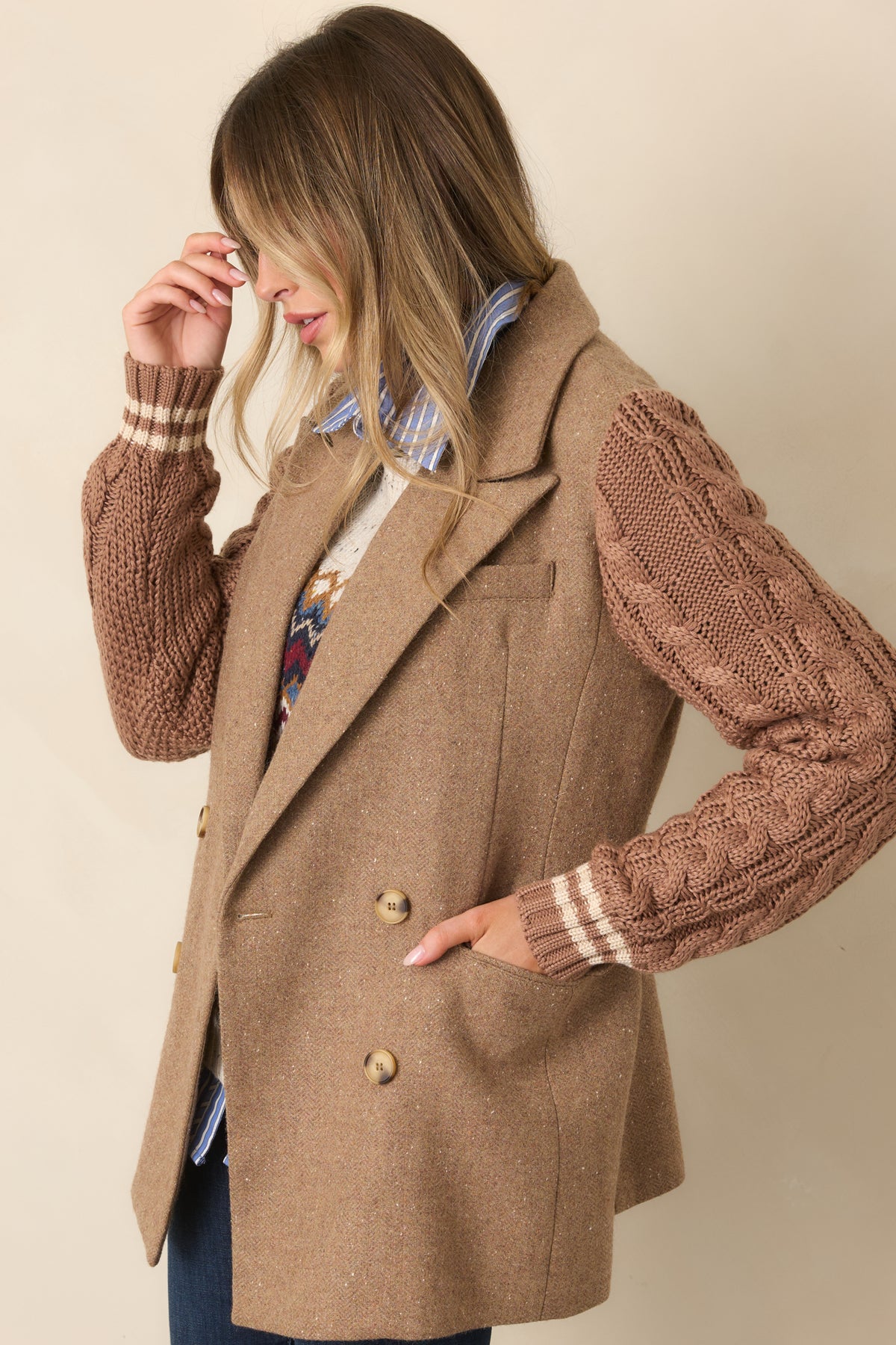 Double-breasted camel blazer detailed with front flap pockets and clean notched lapels.