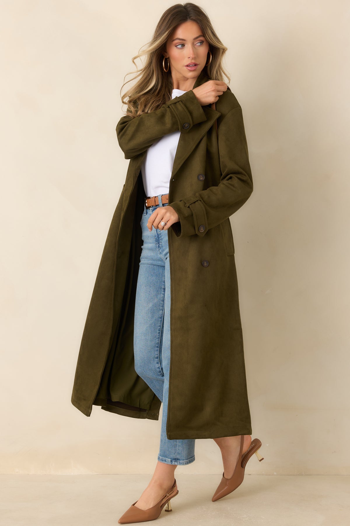 Double-breasted longline coat with a tied waist belt and structured collar.