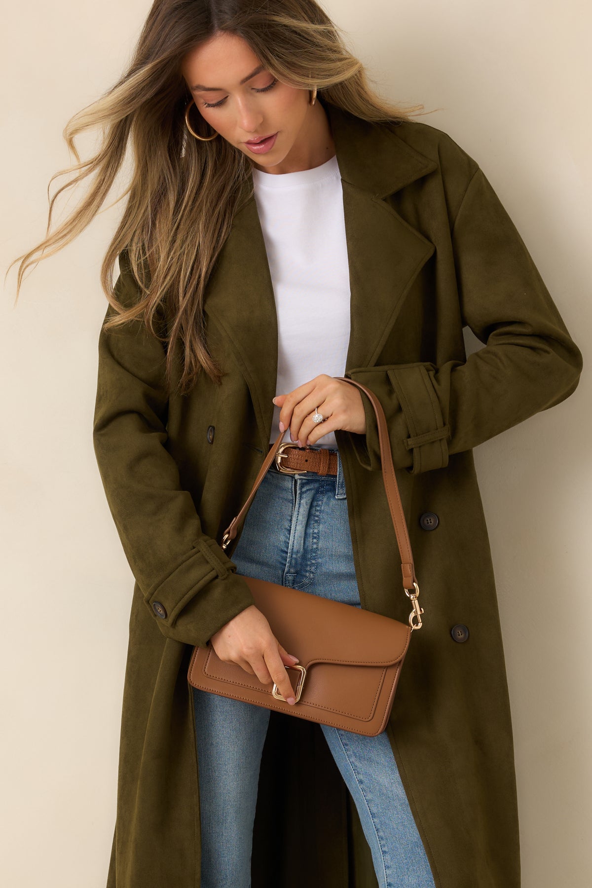 Double rows of buttons accent the front of the classic longline coat.