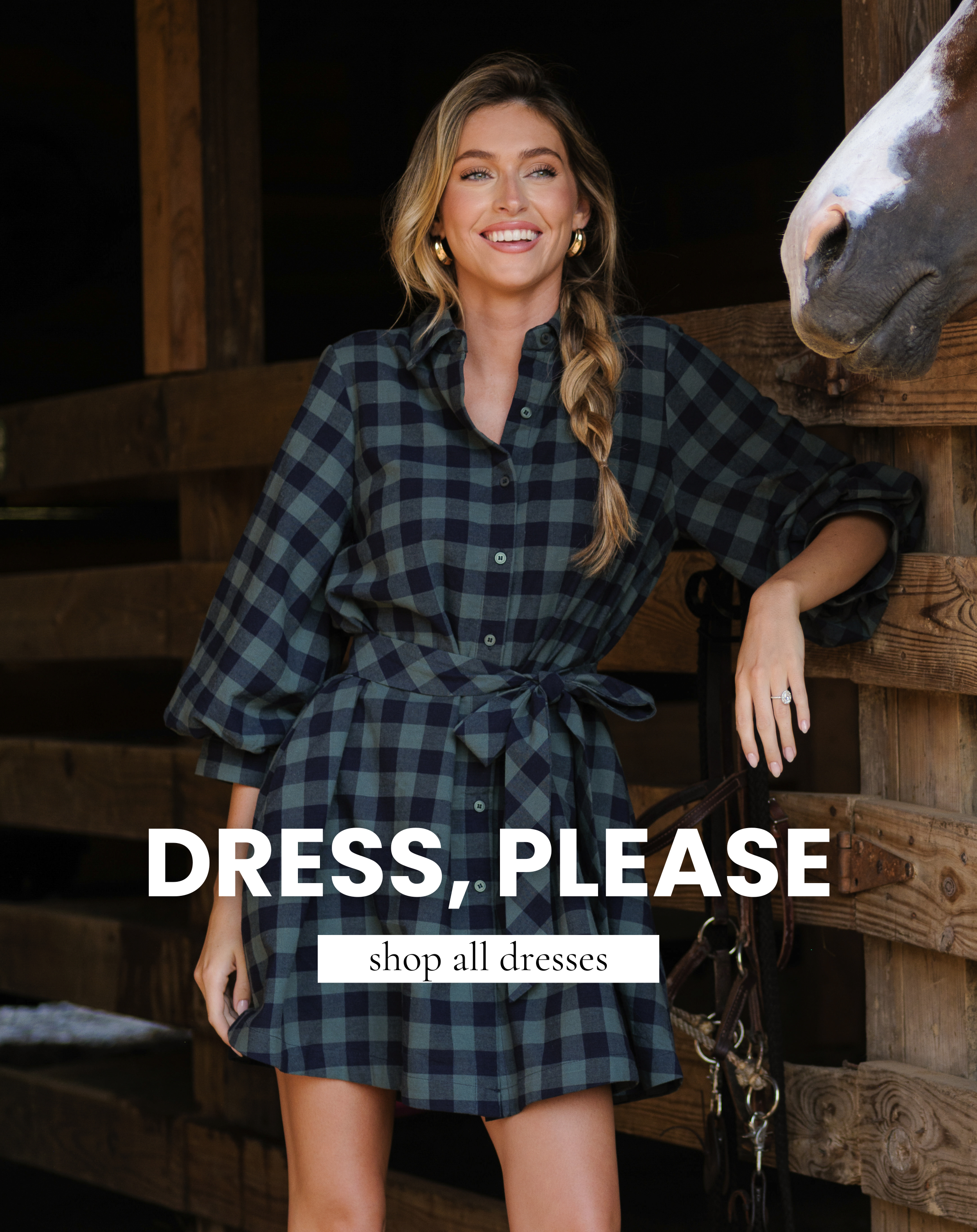 Model a navy and green gingham mini dress. Text reads "Dress, Please" and "Shop All Dresses."