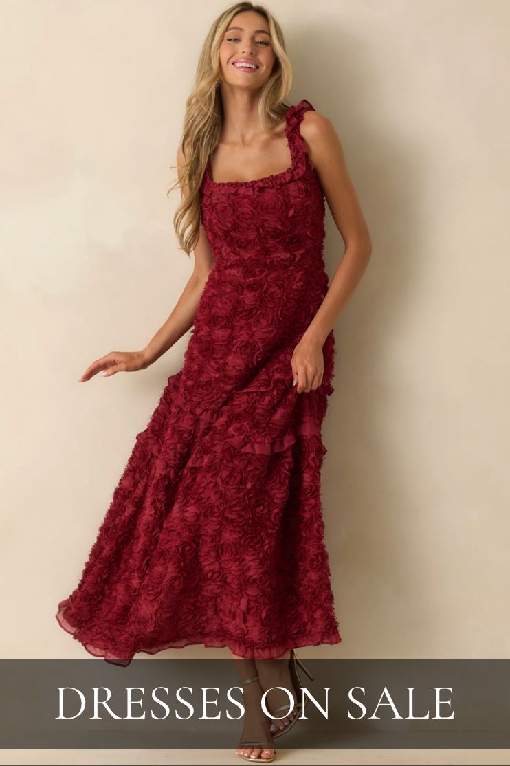 Model wearing a red floral maxi dress. Dresses On Sale.