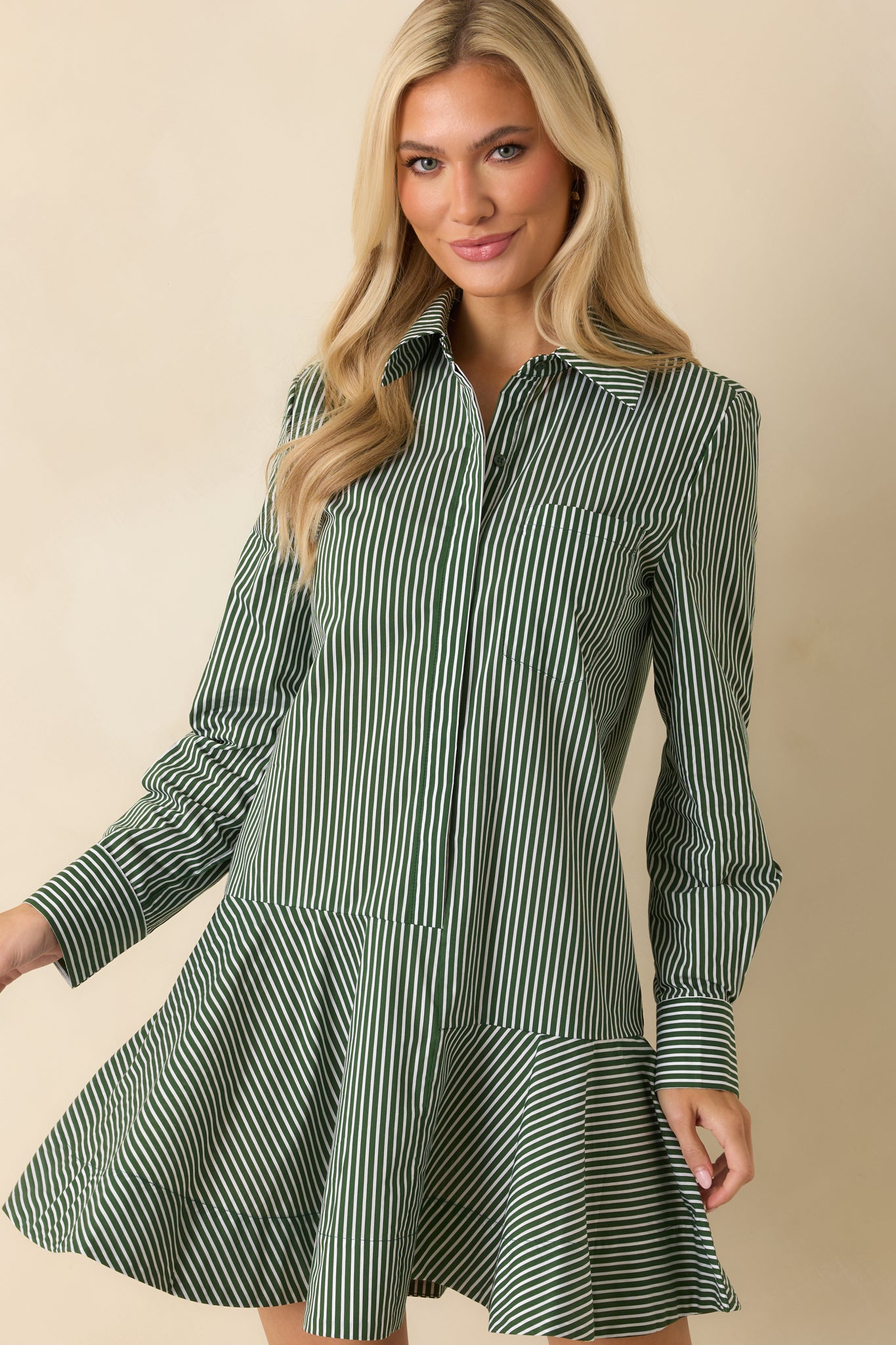 Drop waist seam detail transitioning into a softly flounced A-line skirt for movement.