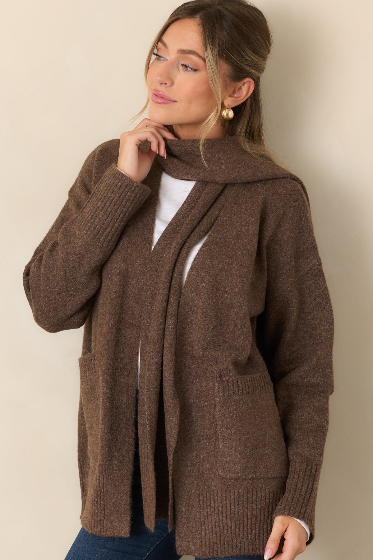 Cardigan highlighting the dropped shoulder construction, open front, and softly textured ribbed cuffs.