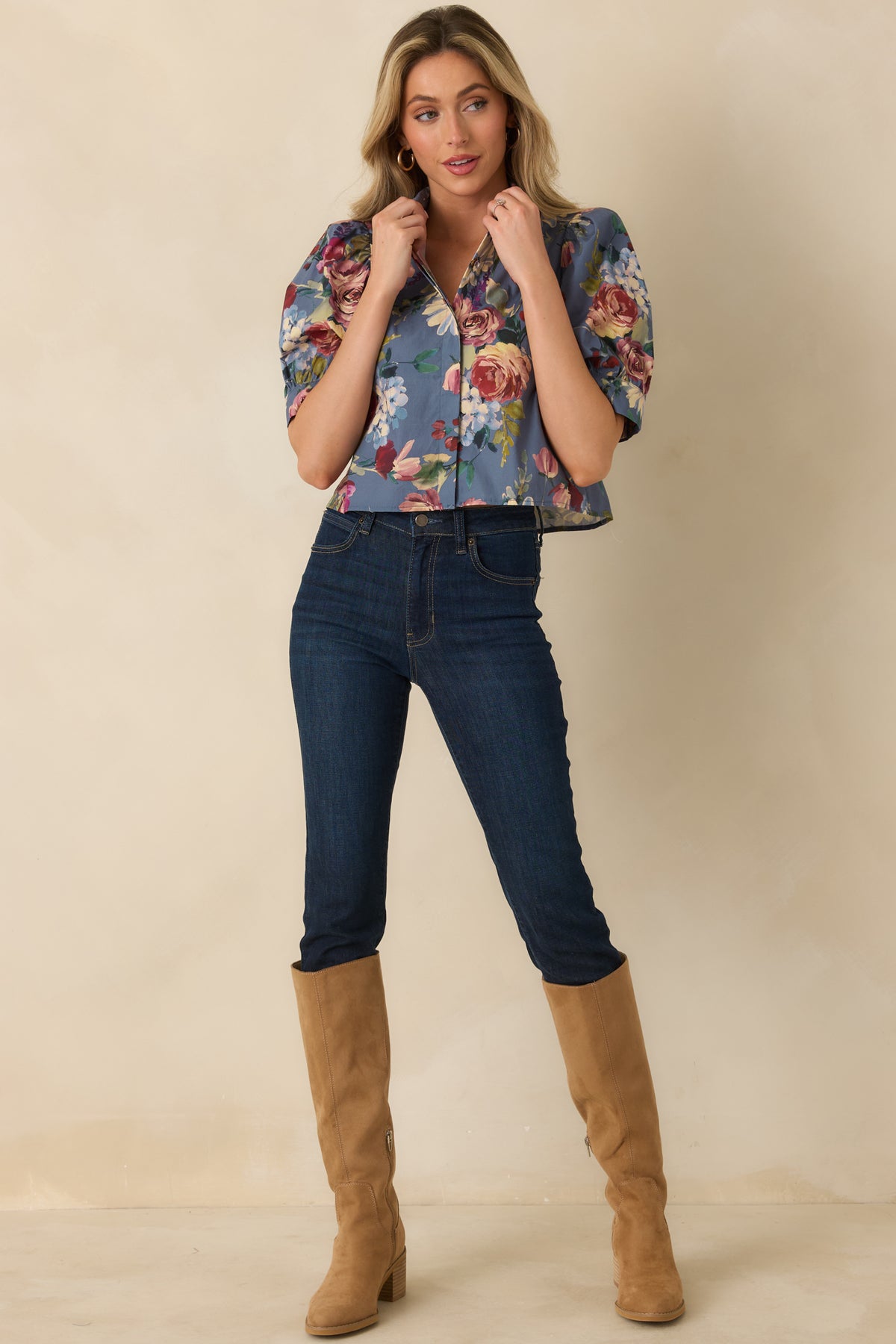 Dusty blue cotton blouse with a relaxed cropped silhouette, elbow-length puff sleeves, and concealed button front.