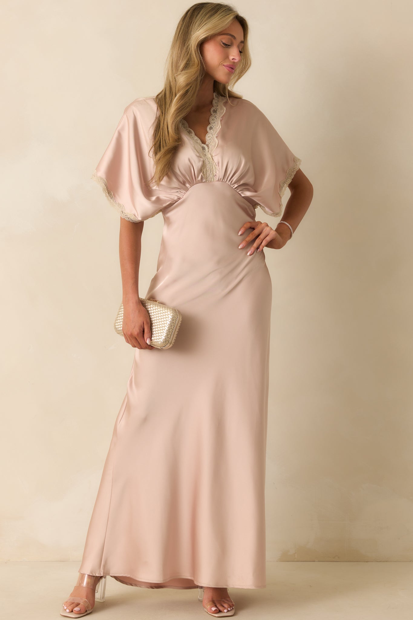Dusty pink satin maxi dress with v-neckline, lace trim, short kimono sleeves, and gathered bust.