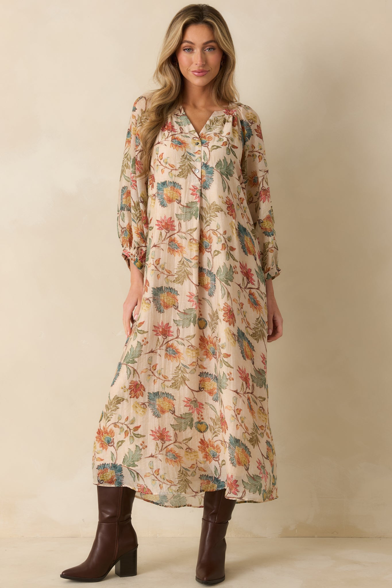 Ecru floral maxi dress with a subtle split neckline and easy, draped shape for an effortless look.