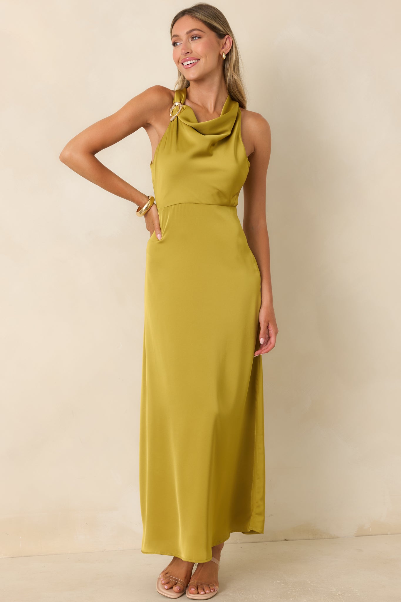 Elegant chartreuse maxi dress with a silky satin finish, empire waist, and graceful flowing shape.