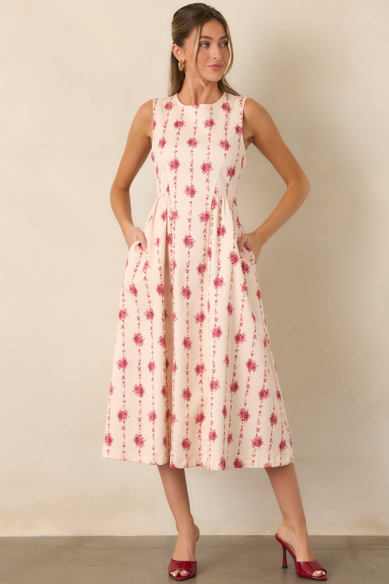 Elegant sleeveless midi showcasing a structured cotton-blend construction, elongated floral stripes, and a polished fit-and-flare shape.