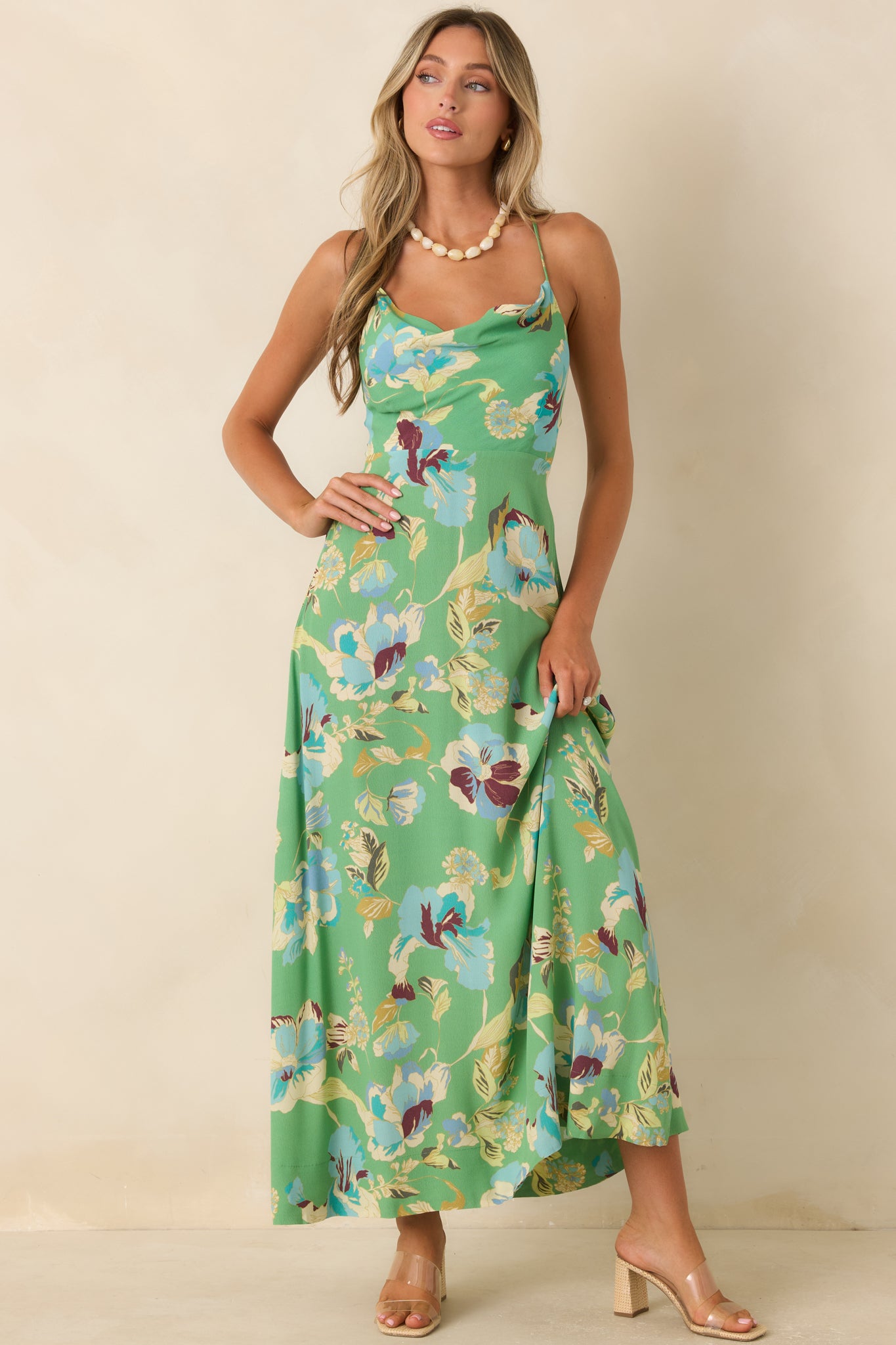 Elegant green floral maxi dress featuring a full-length skirt and beautifully draped cowl neckline.