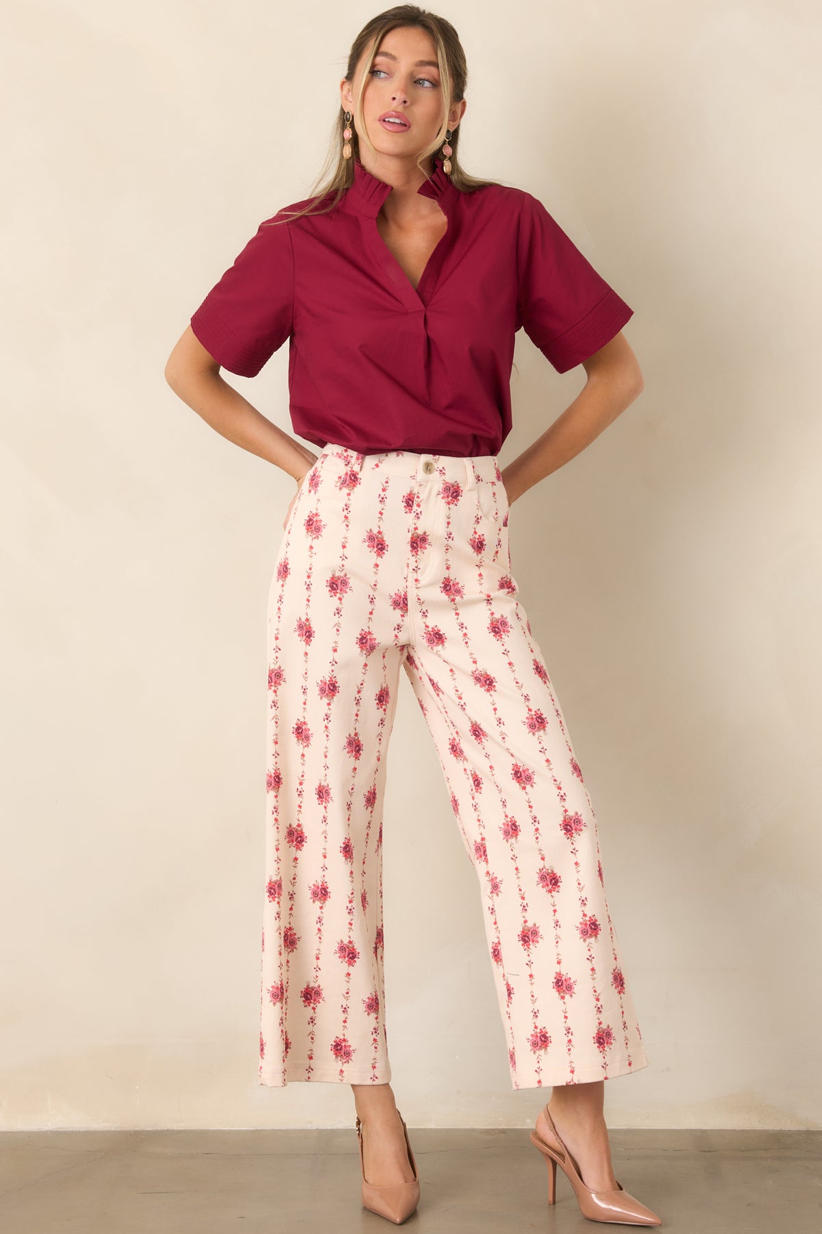 Elevated cotton top showcasing a feminine ruffle collar, relaxed split neckline, short sleeves, and softly draped silhouette.