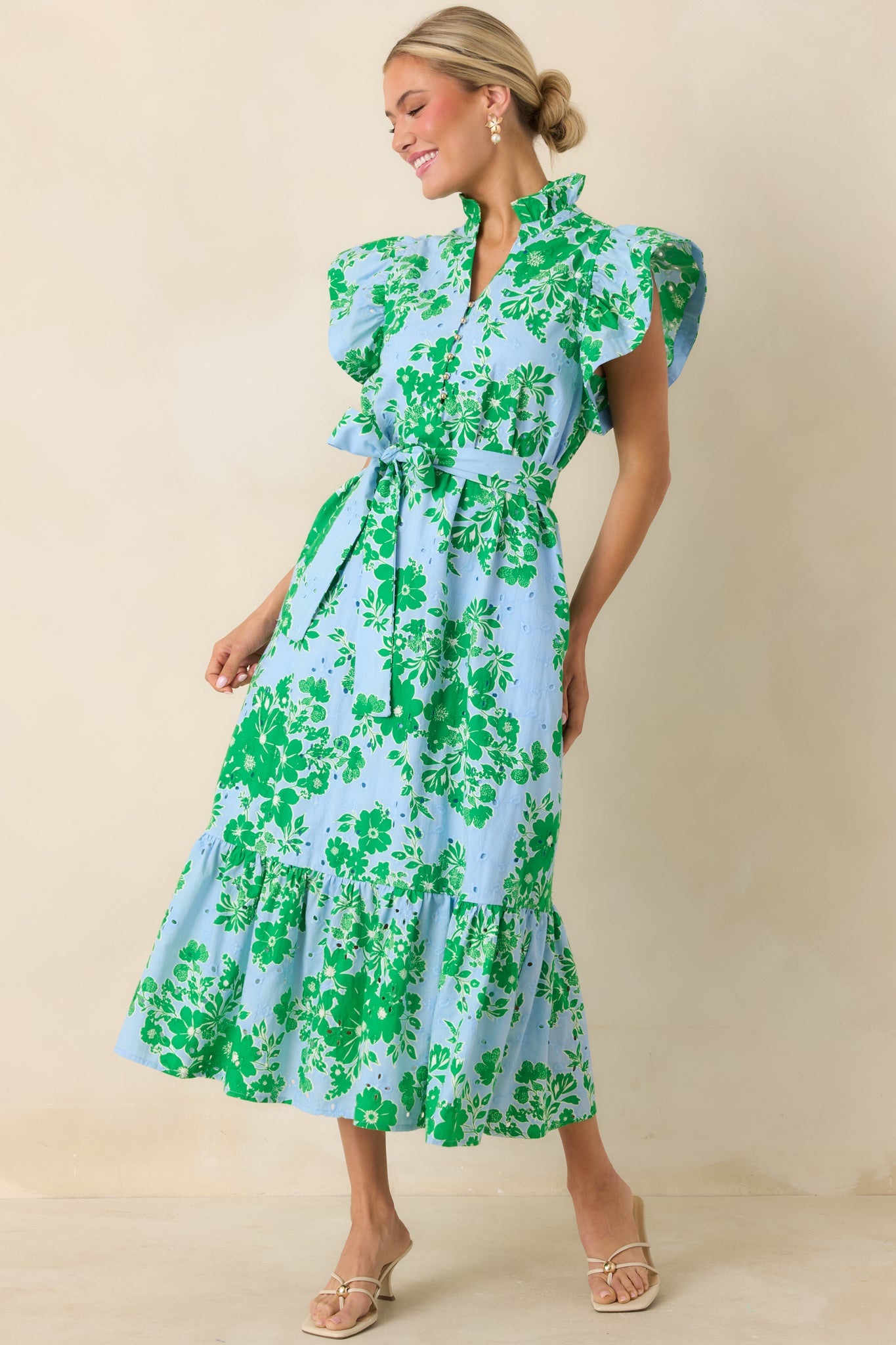 Embroidered midi dress with subtle ruffle hem and flowing silhouette.