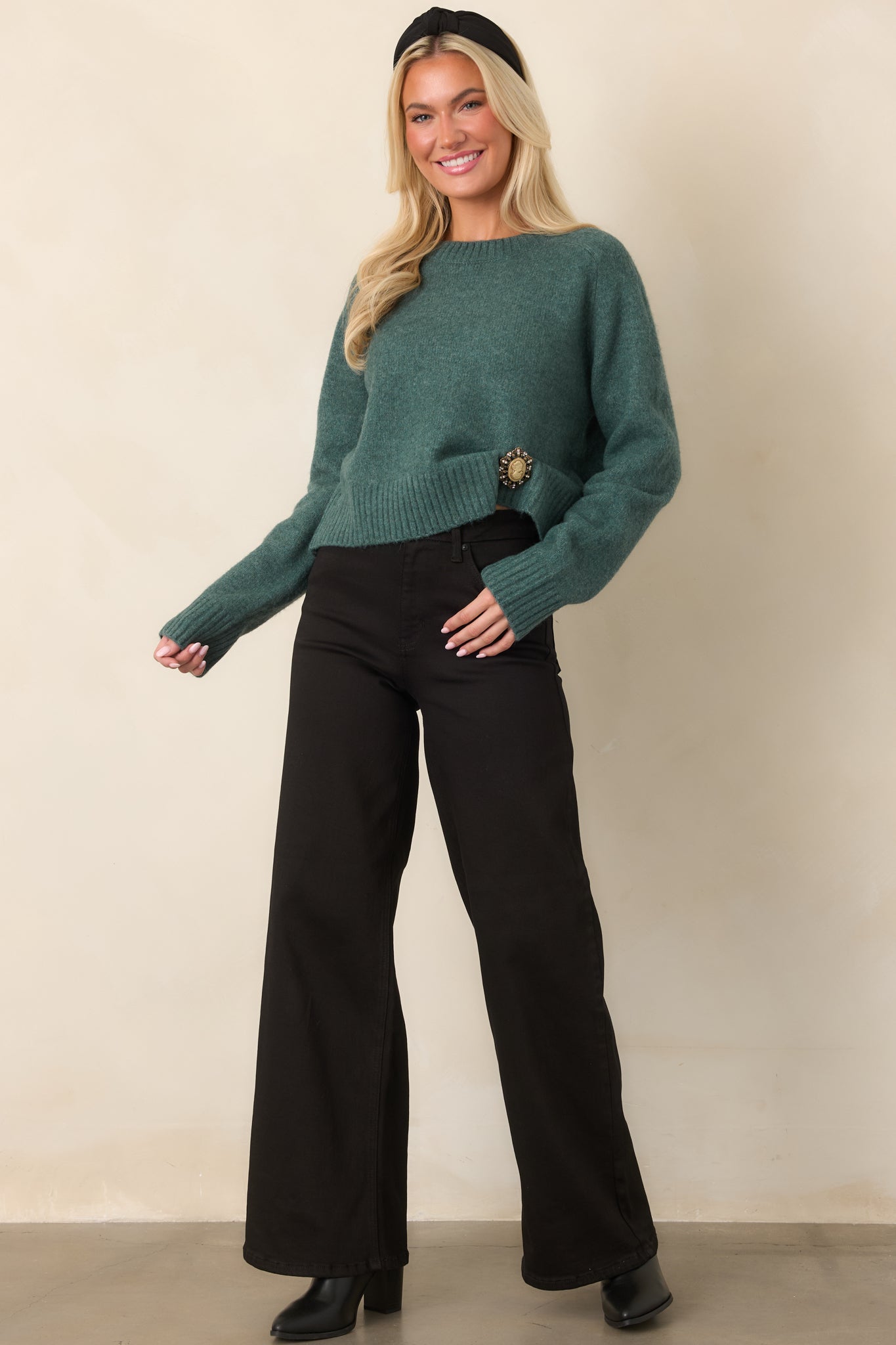 Emerald Cove green knit top with a cozy textured finish, classic crew neck, full-length sleeves, and ribbed trim.