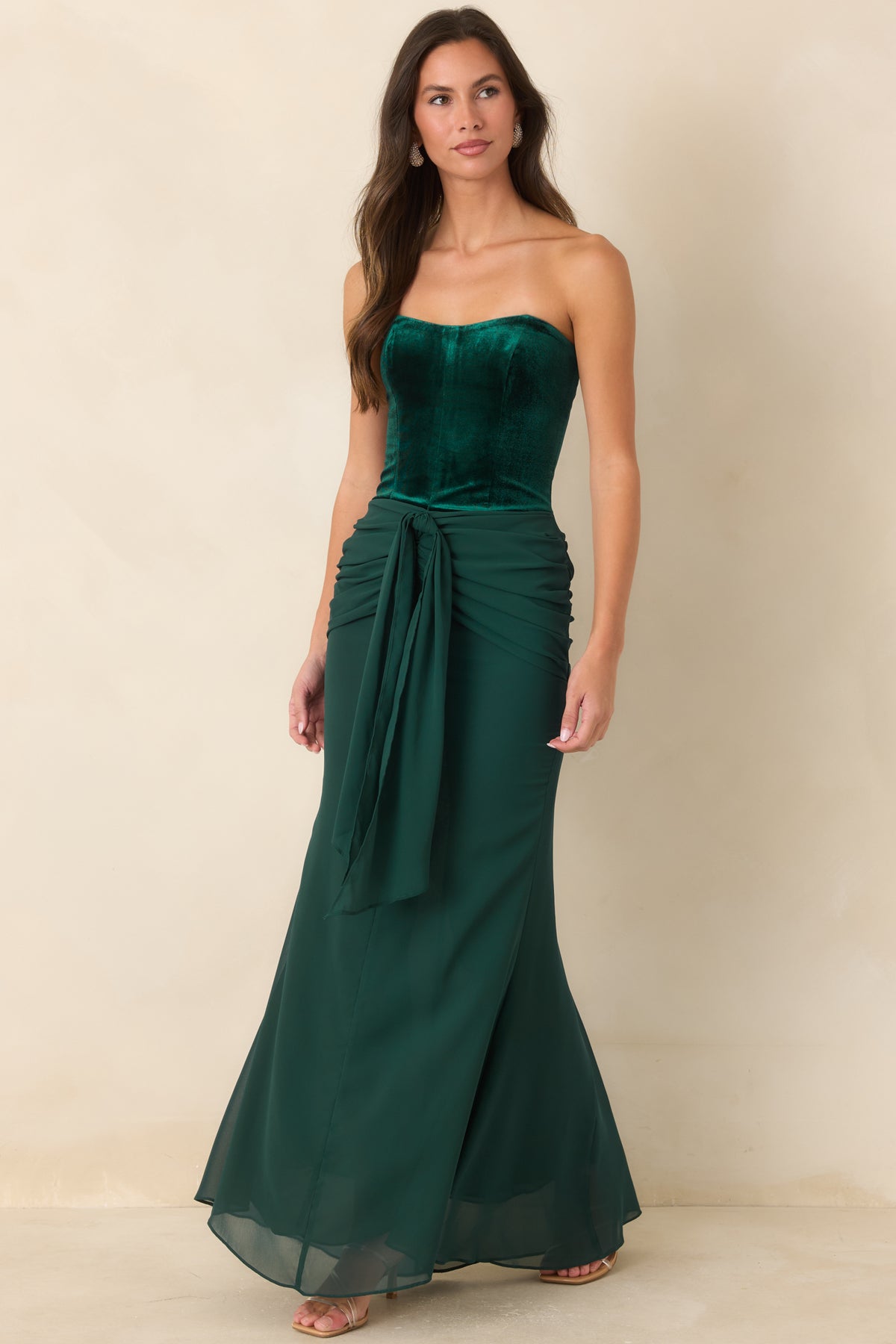 Rich emerald maxi dress with a fitted velvet bodice and softly flared chiffon skirt.