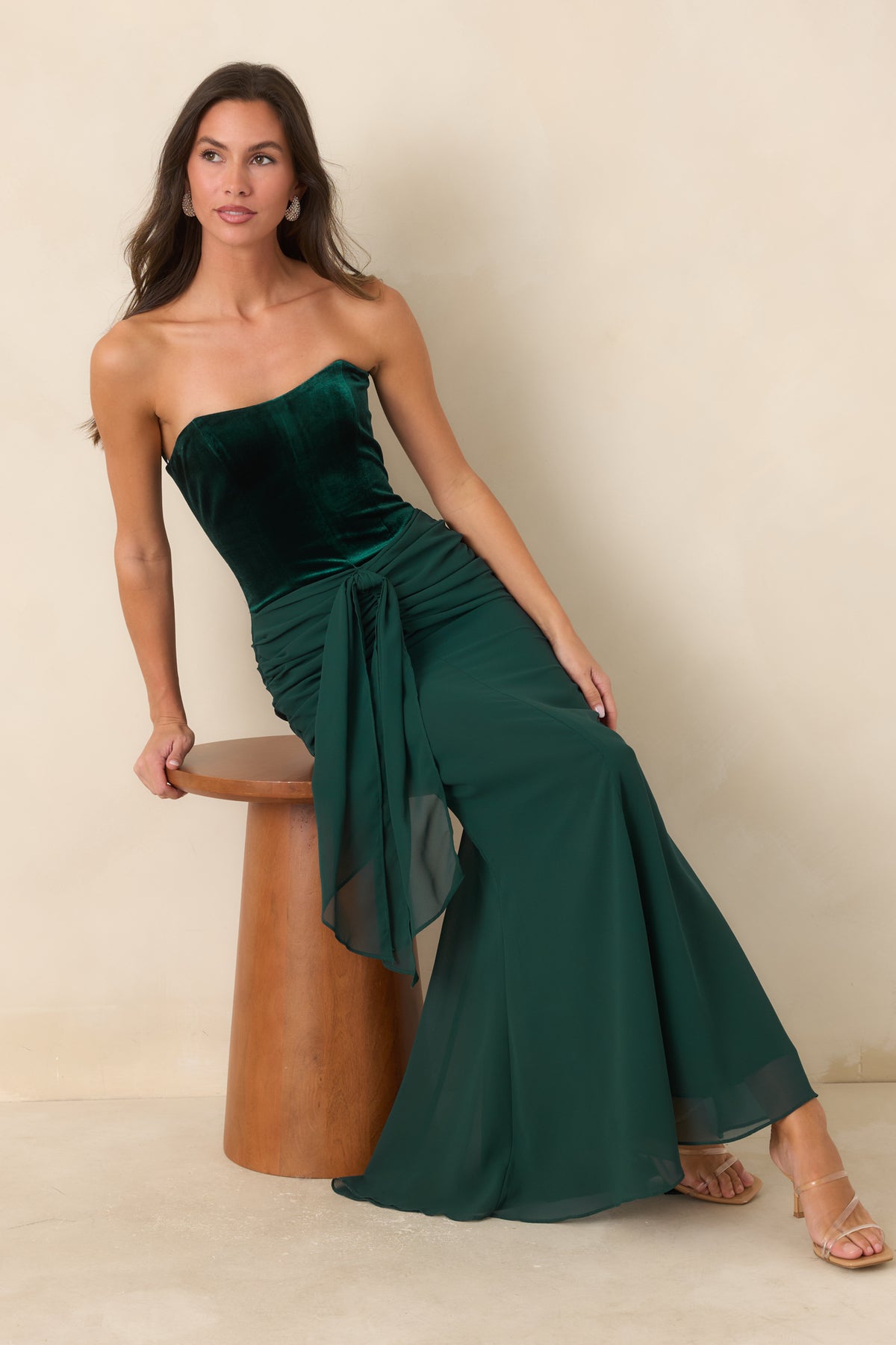 Emerald velvet strapless maxi dress featuring a structured bodice and flowing chiffon skirt.