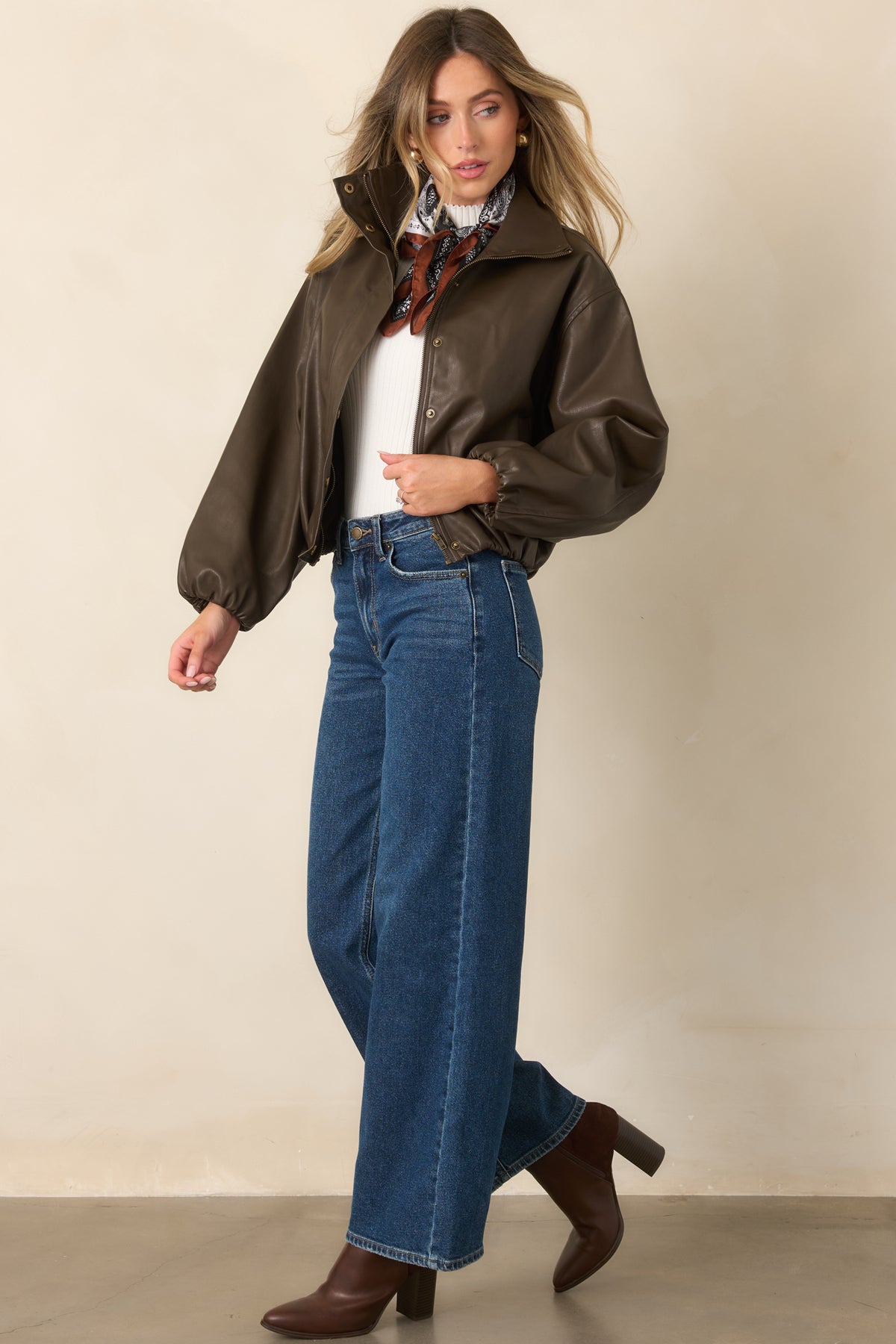 Espresso jacket showcasing dropped shoulders, oversized balloon sleeves, elasticized cuffs, and a relaxed shape.
