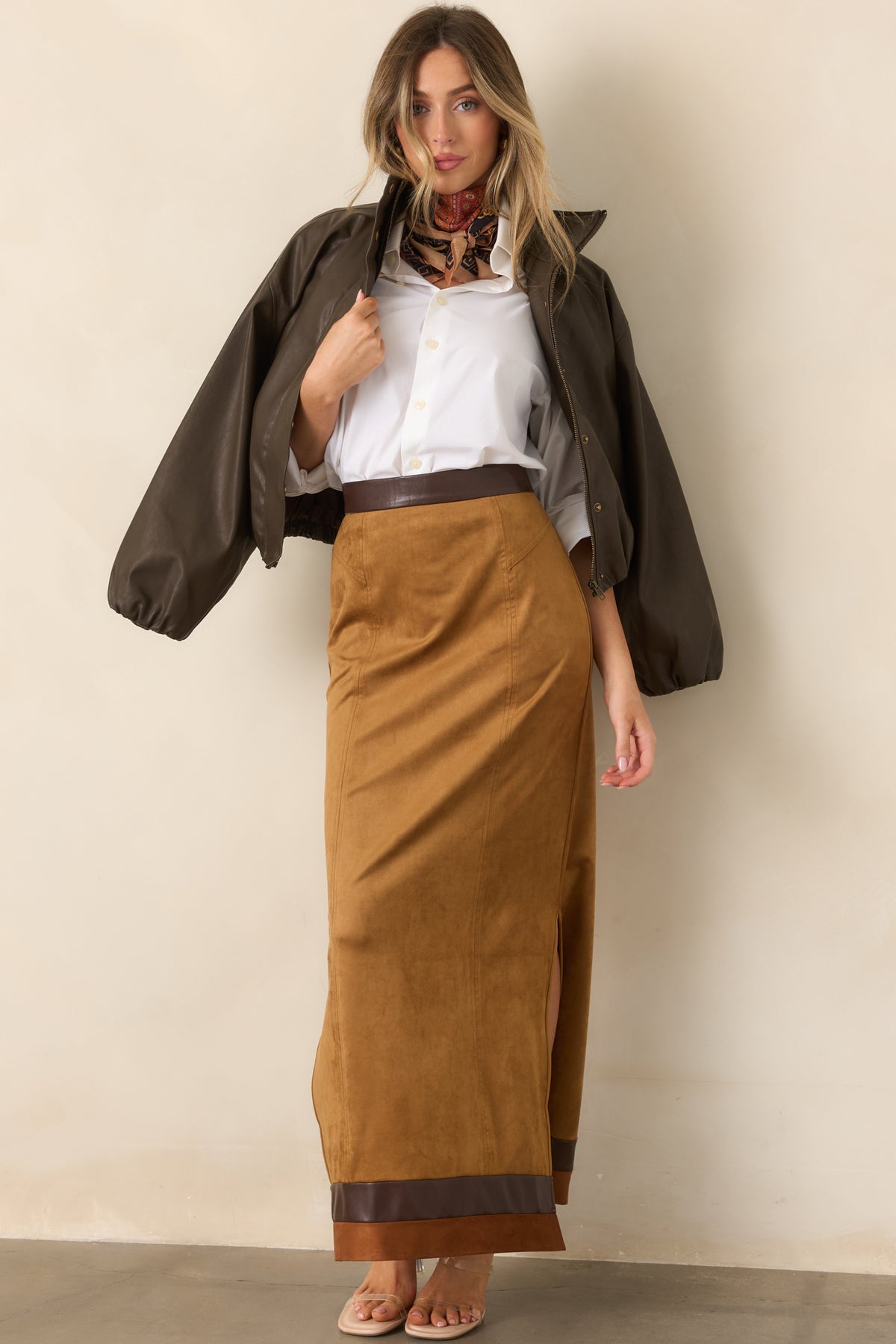 Rich espresso faux leather jacket with dramatic balloon sleeves, dropped shoulders, and a high stand collar.