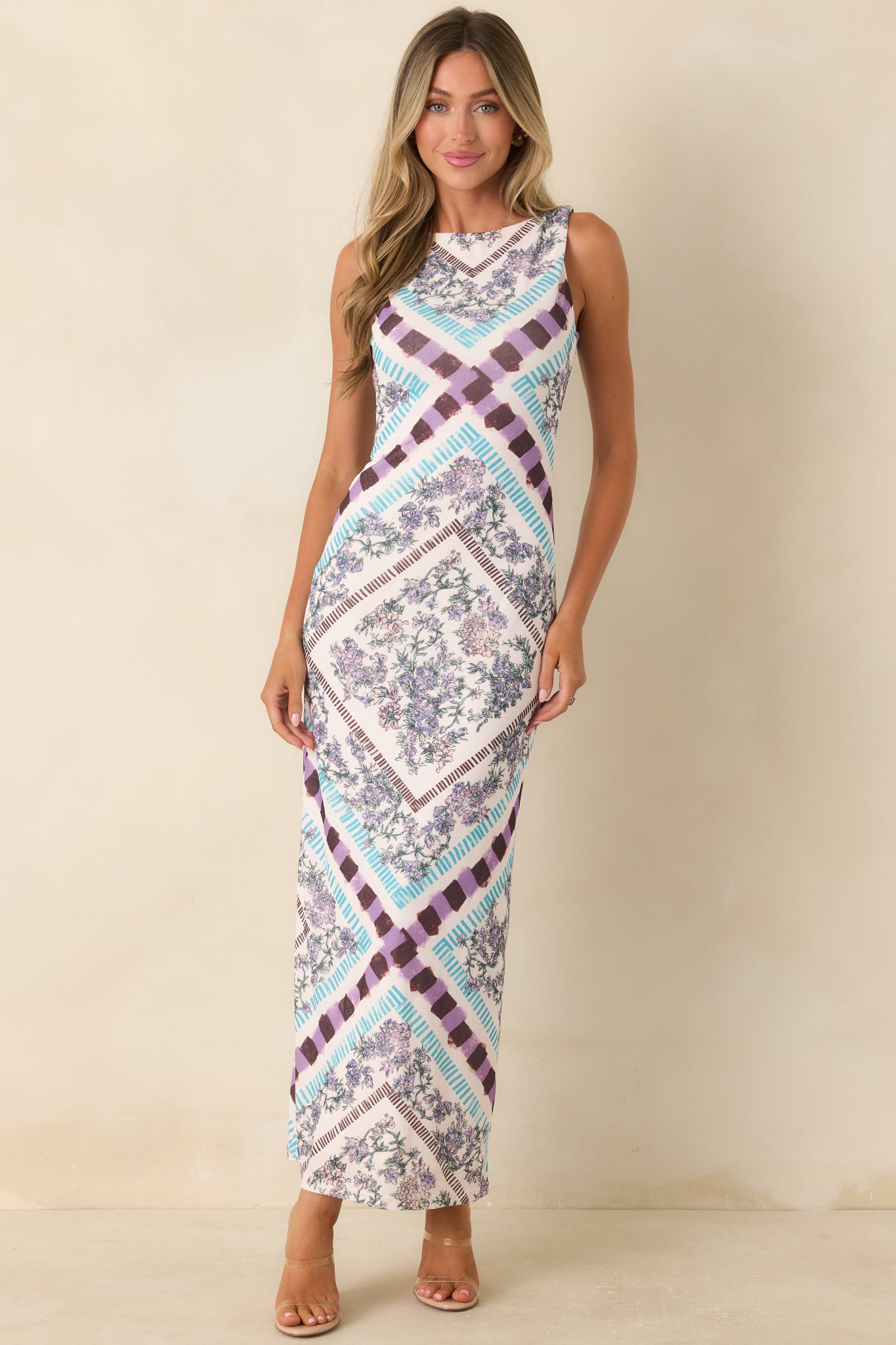 European getaway-inspired midi dress showcasing a colorful scarf print and graceful fitted design.