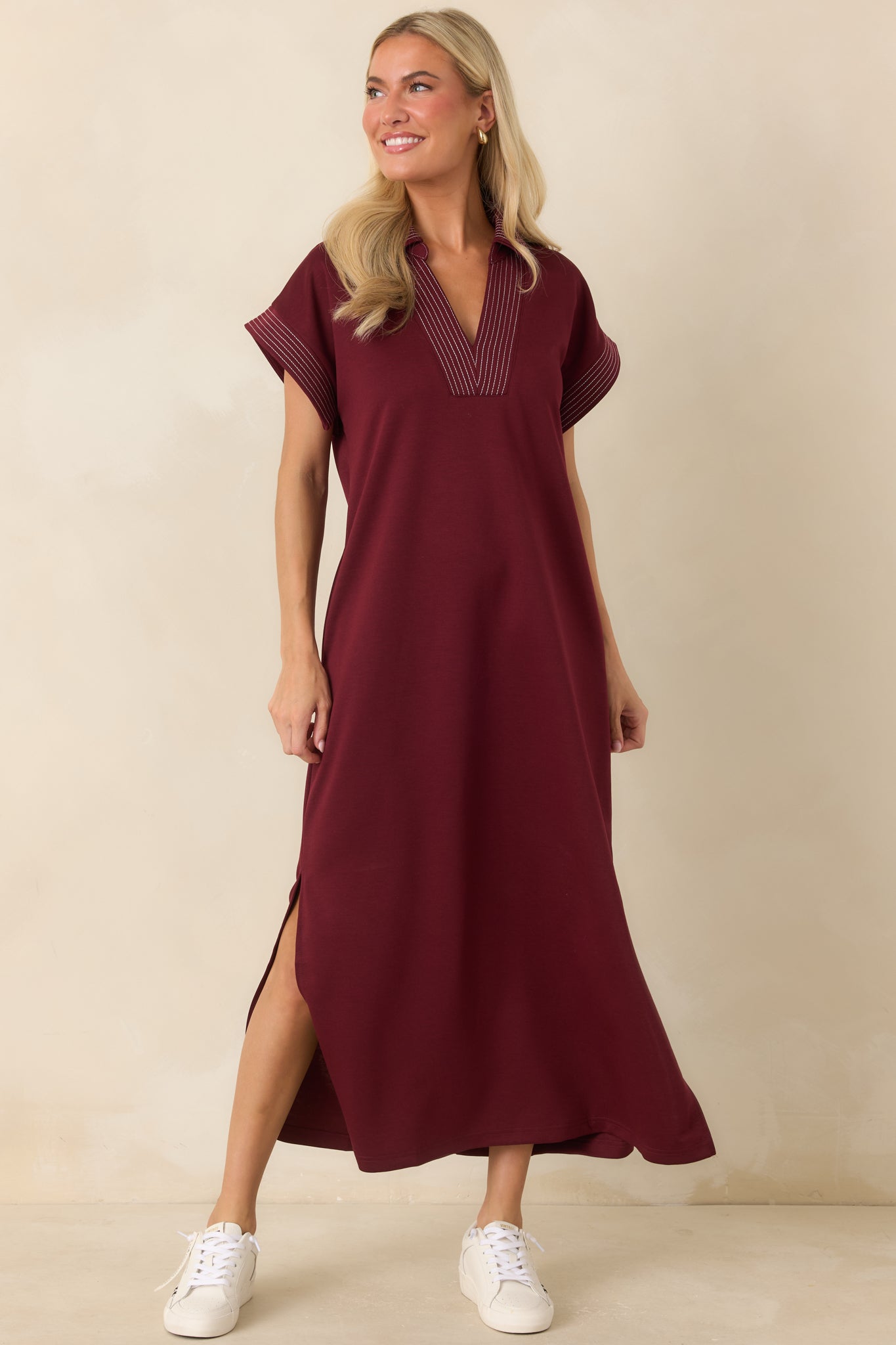 Everyday dress featuring side slits, a structured neckline, and comfortable relaxed design.