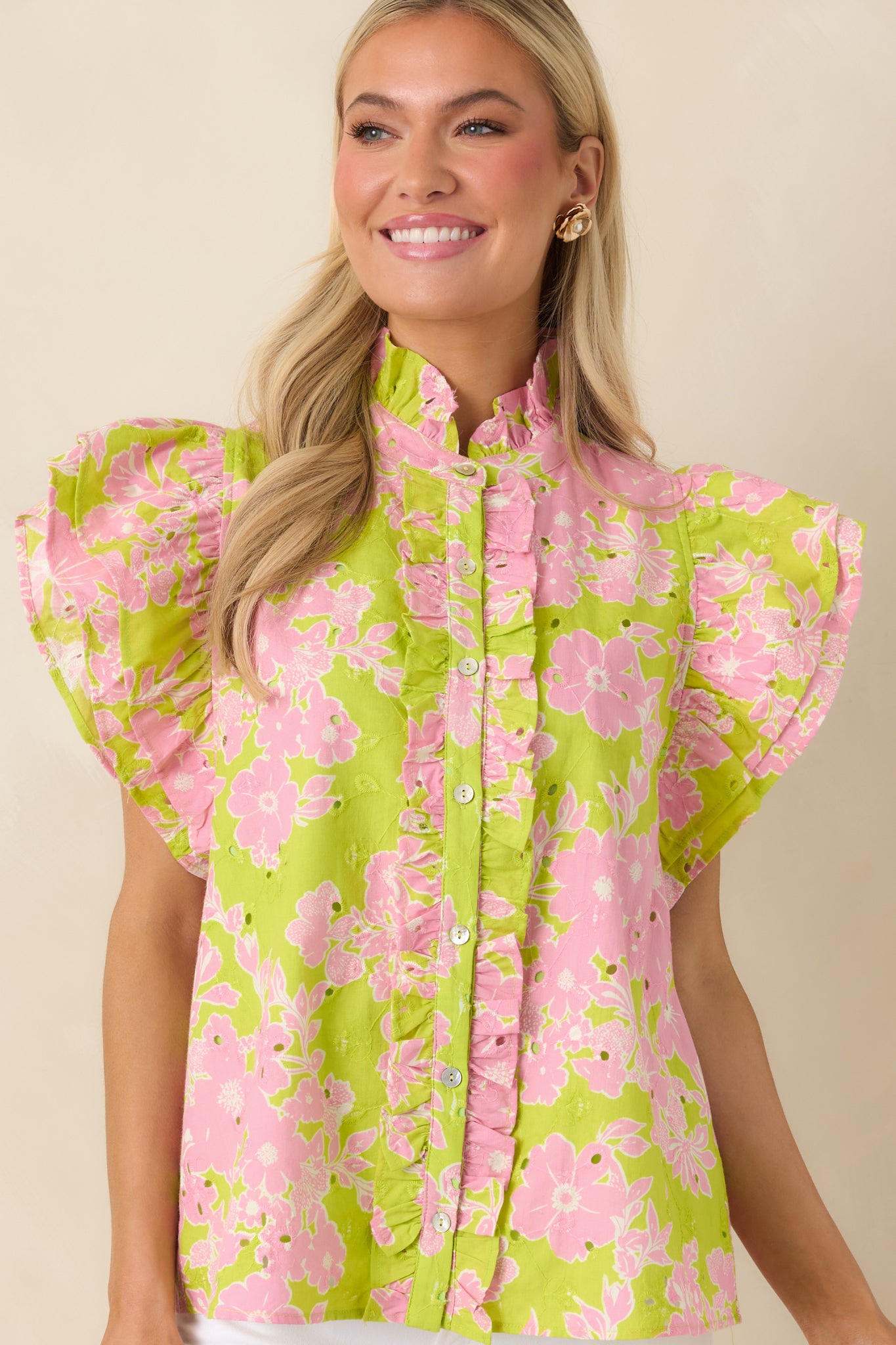 Eyelet embroidered top with detailed stitching and relaxed drape.